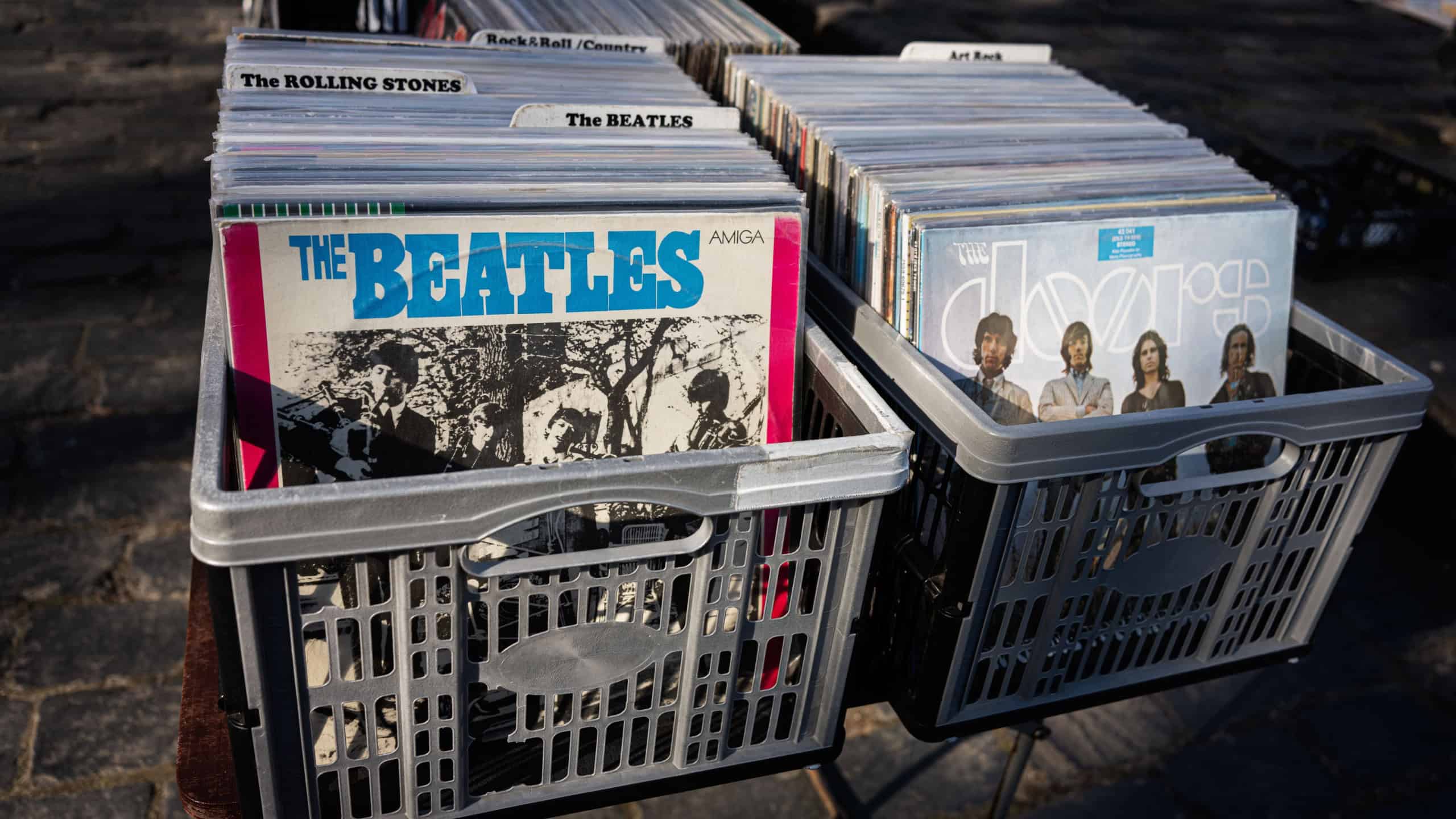 Two crates of vinyl records including albums from The Beatles and The Doors.