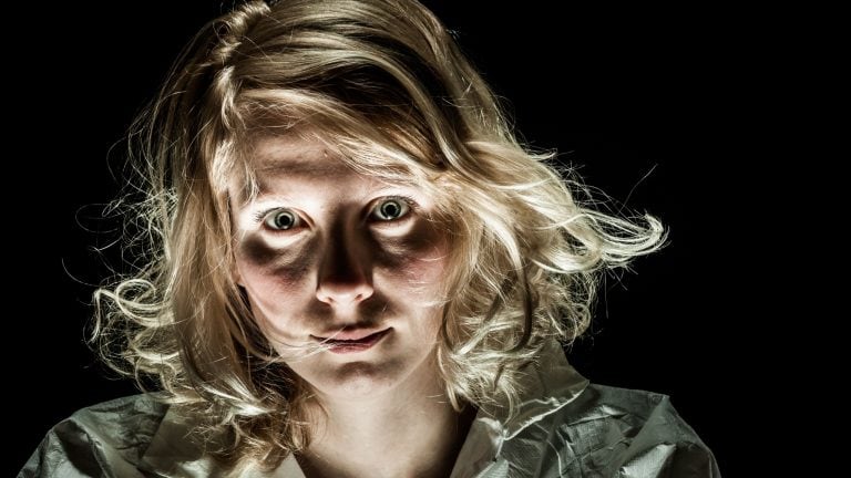 mad Woman with Emotional Disorder Looking at the Camera