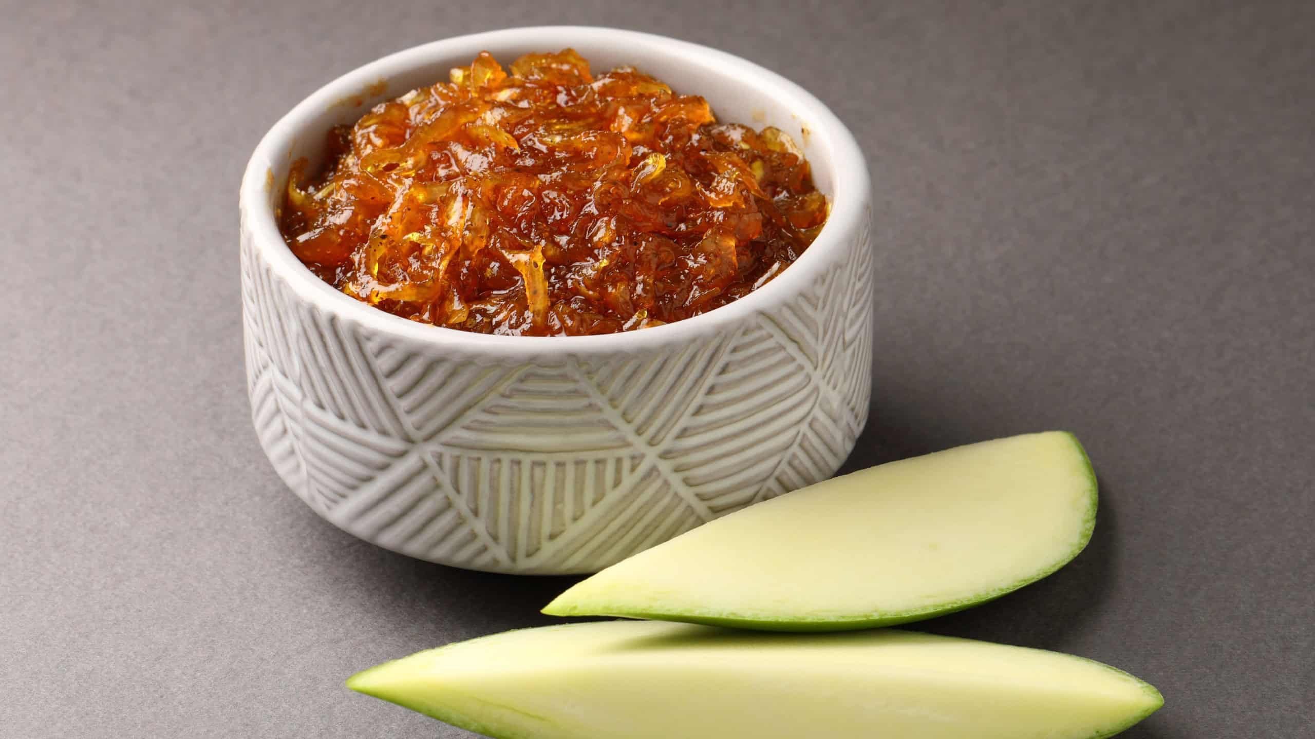 Traditional Indian Aam ki Chutney Green mango chutney in a bowl served with Chapati roti or Thepla in the state of Gujarat india
