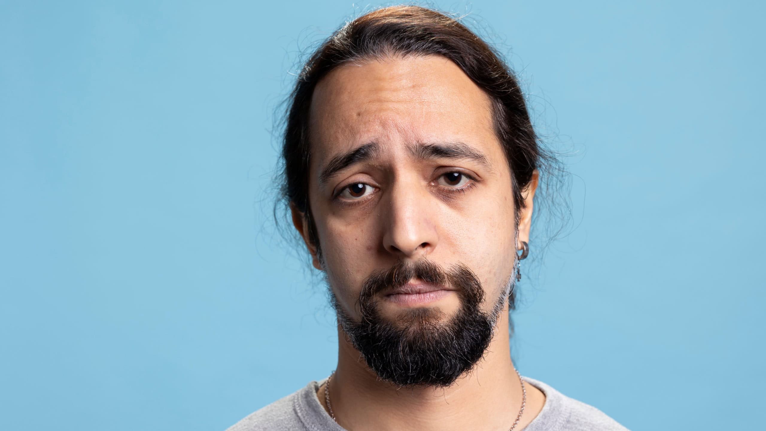Disappointed sad tired guy feeling distressed and discouraged on camera, dealing with low self esteem and emotional crisis. Depressed unhappy person suffers from anxiety or grief.