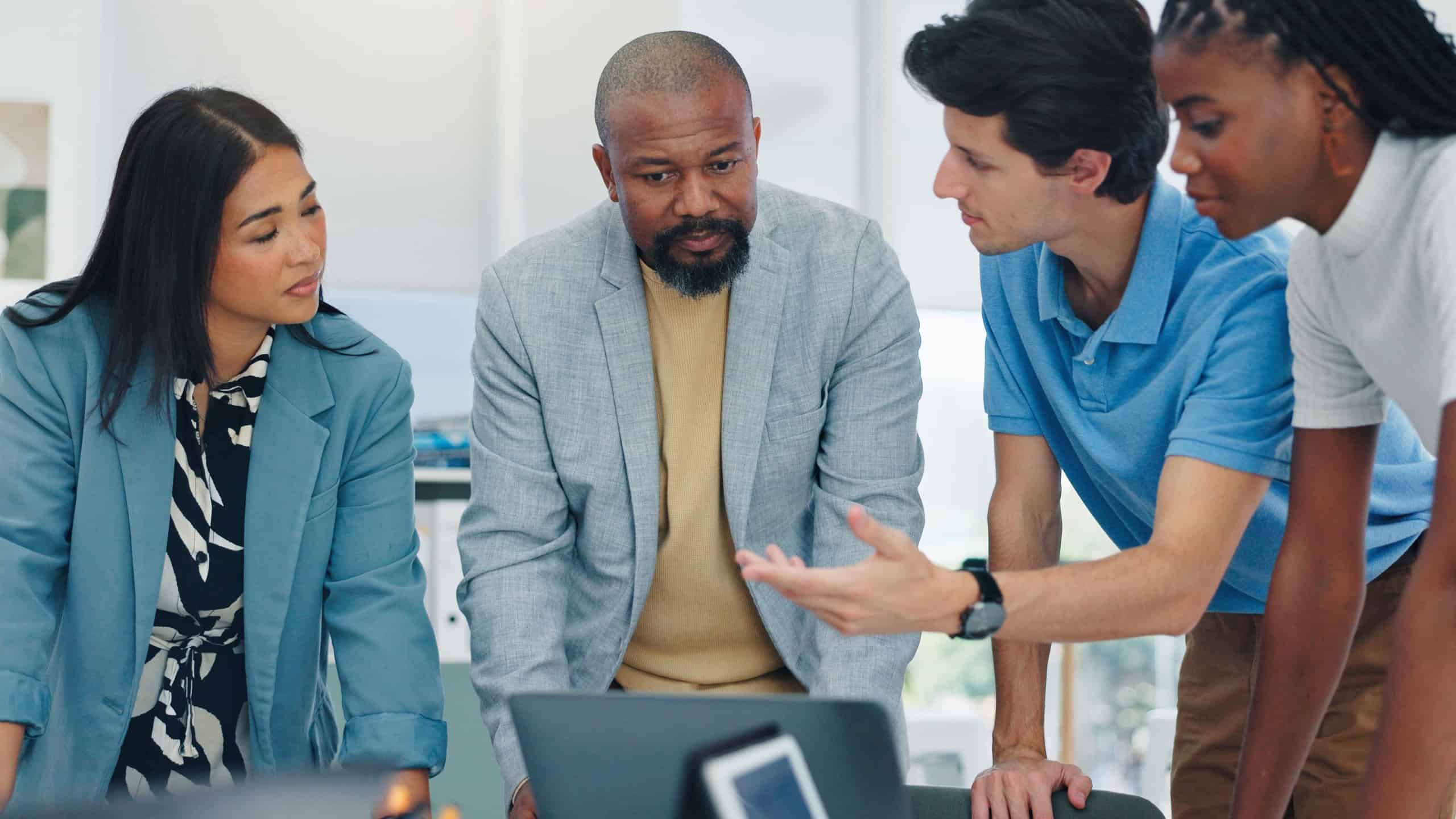 Business, people and explain with laptop in office for planning, finance report and review budget. Staff, team and briefing with pc for bookkeeping, company accounts and audit feedback for investment