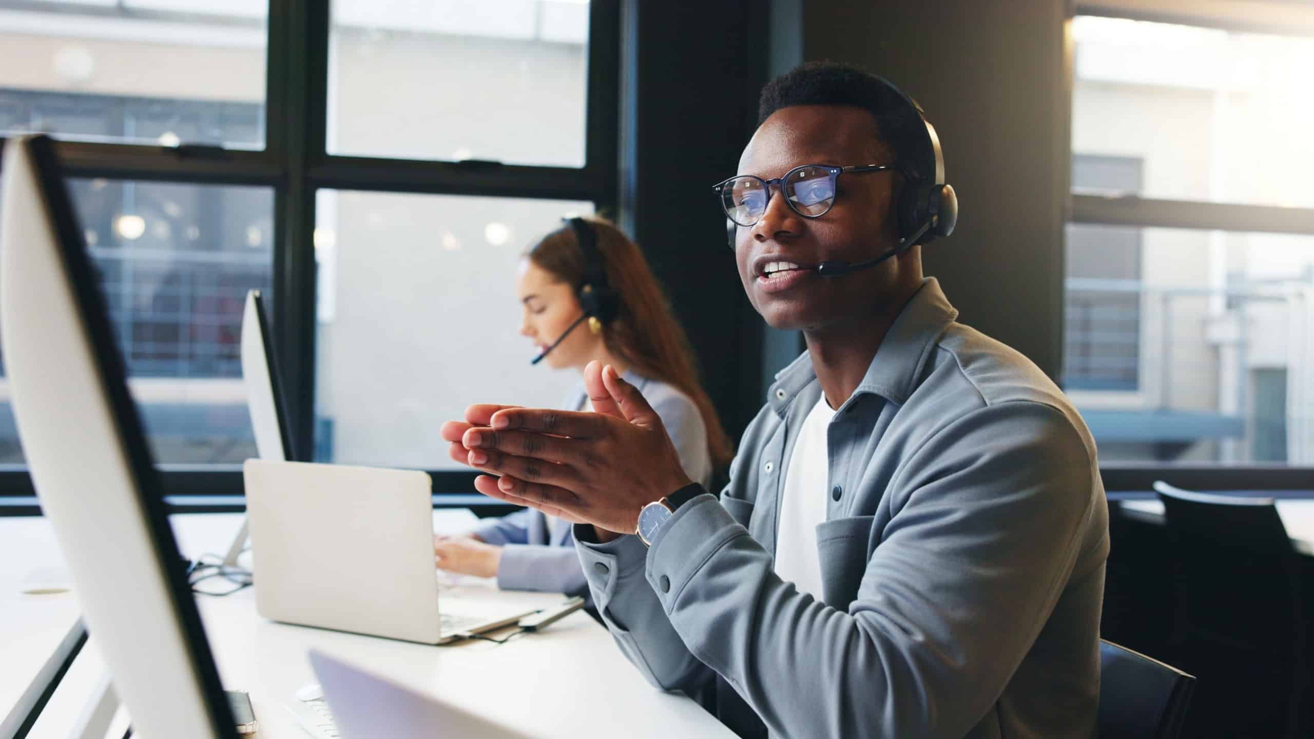 Computer, call center and man in office talking for online advice, help and customer support. Professional, coworking and business person with headset for virtual consulting, contact and crm service