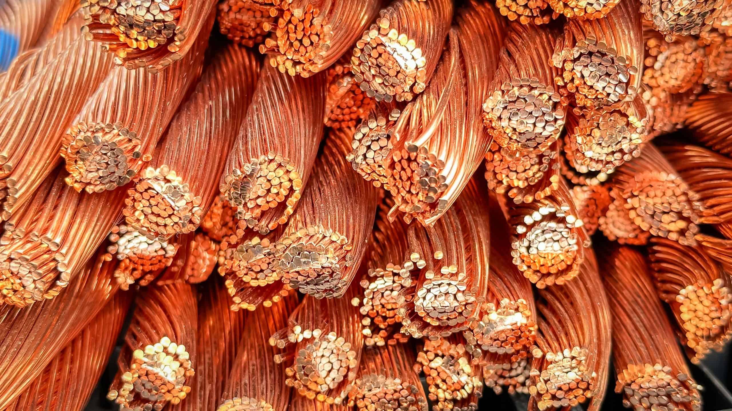 Close-up shot of frayed copper wires displaying strands and oxidation.