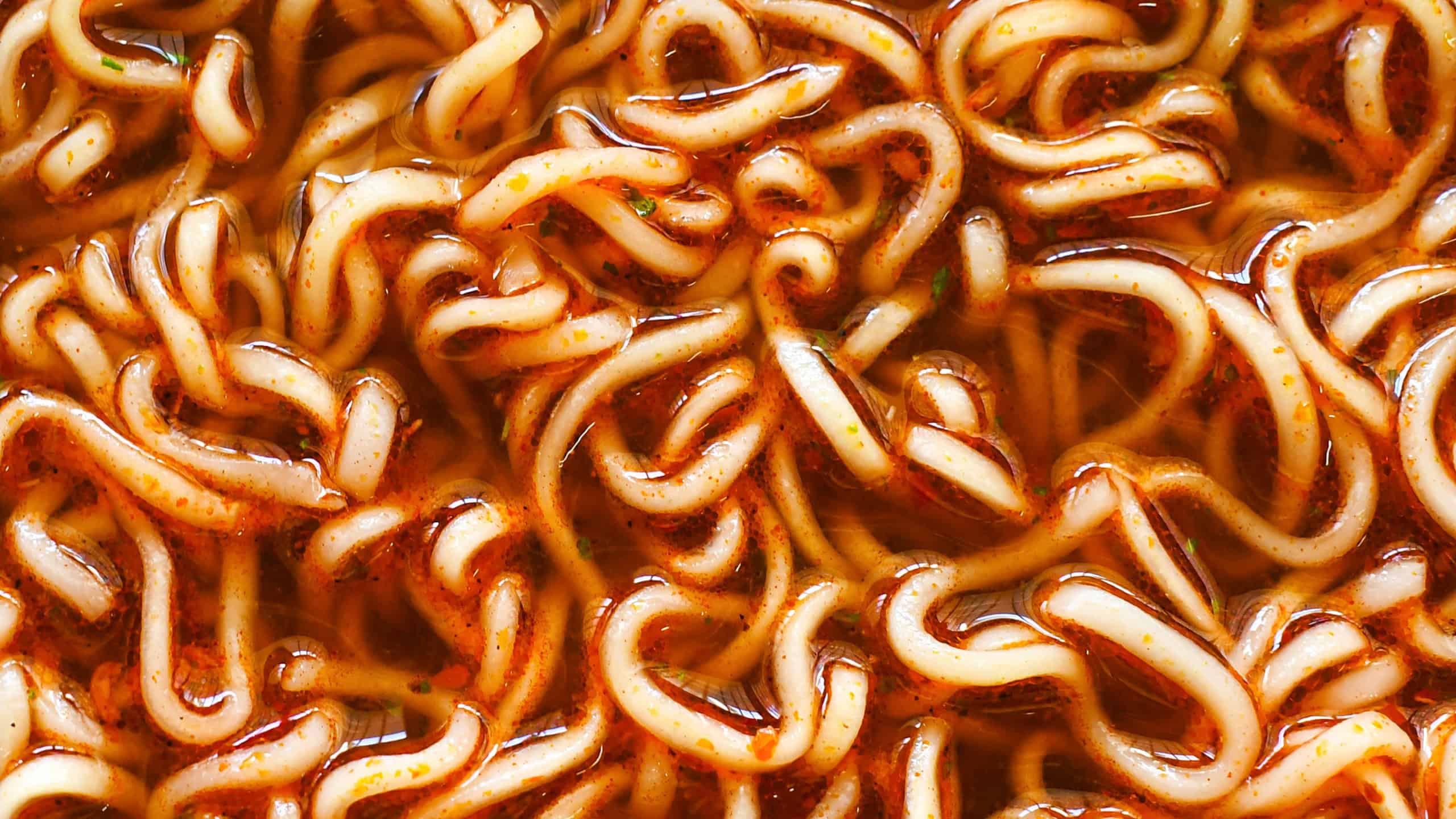 Instant noodle soup texture background. Spicy noodles. Asian food.