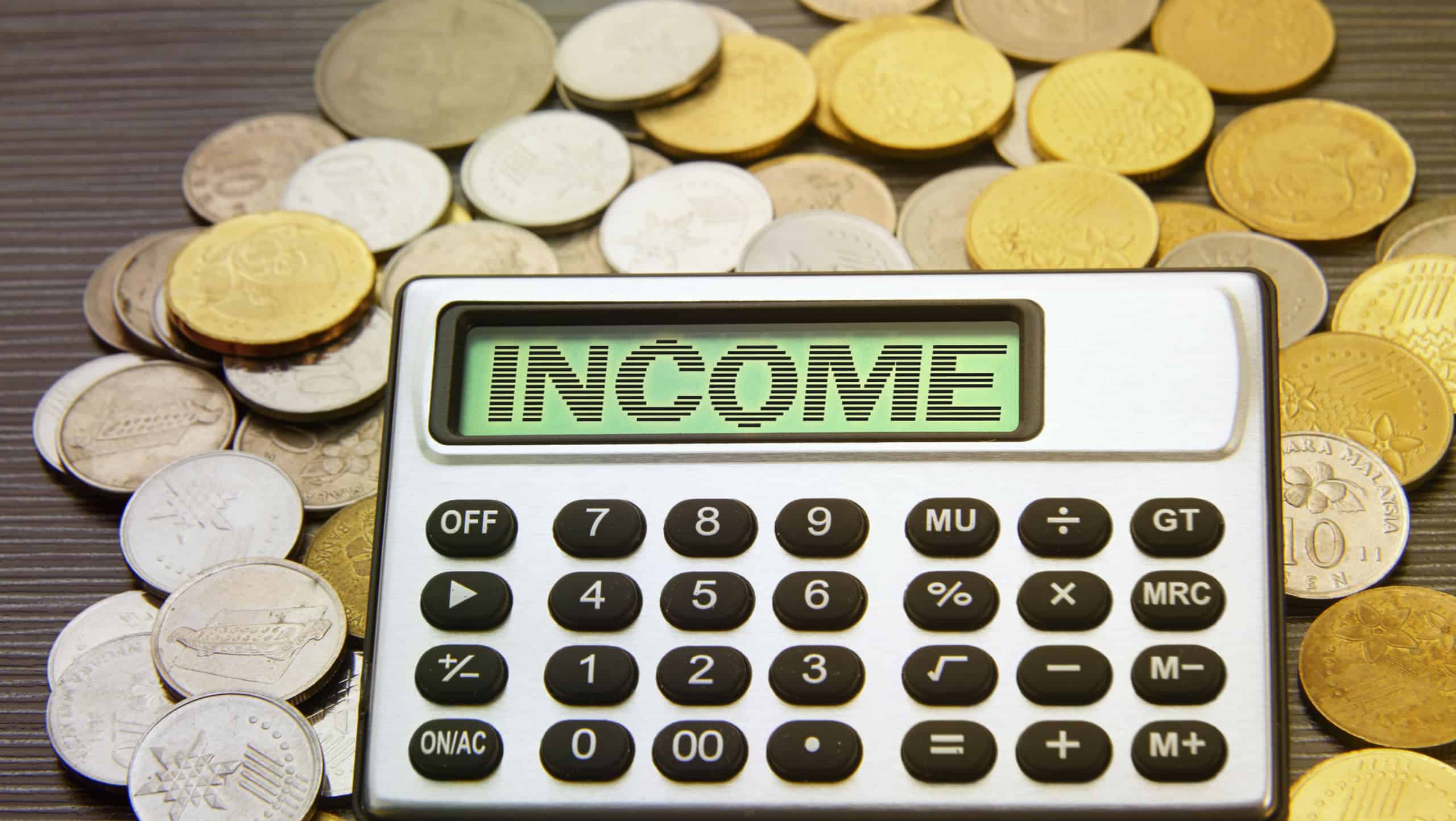 coins and silver calculator with text on display-income