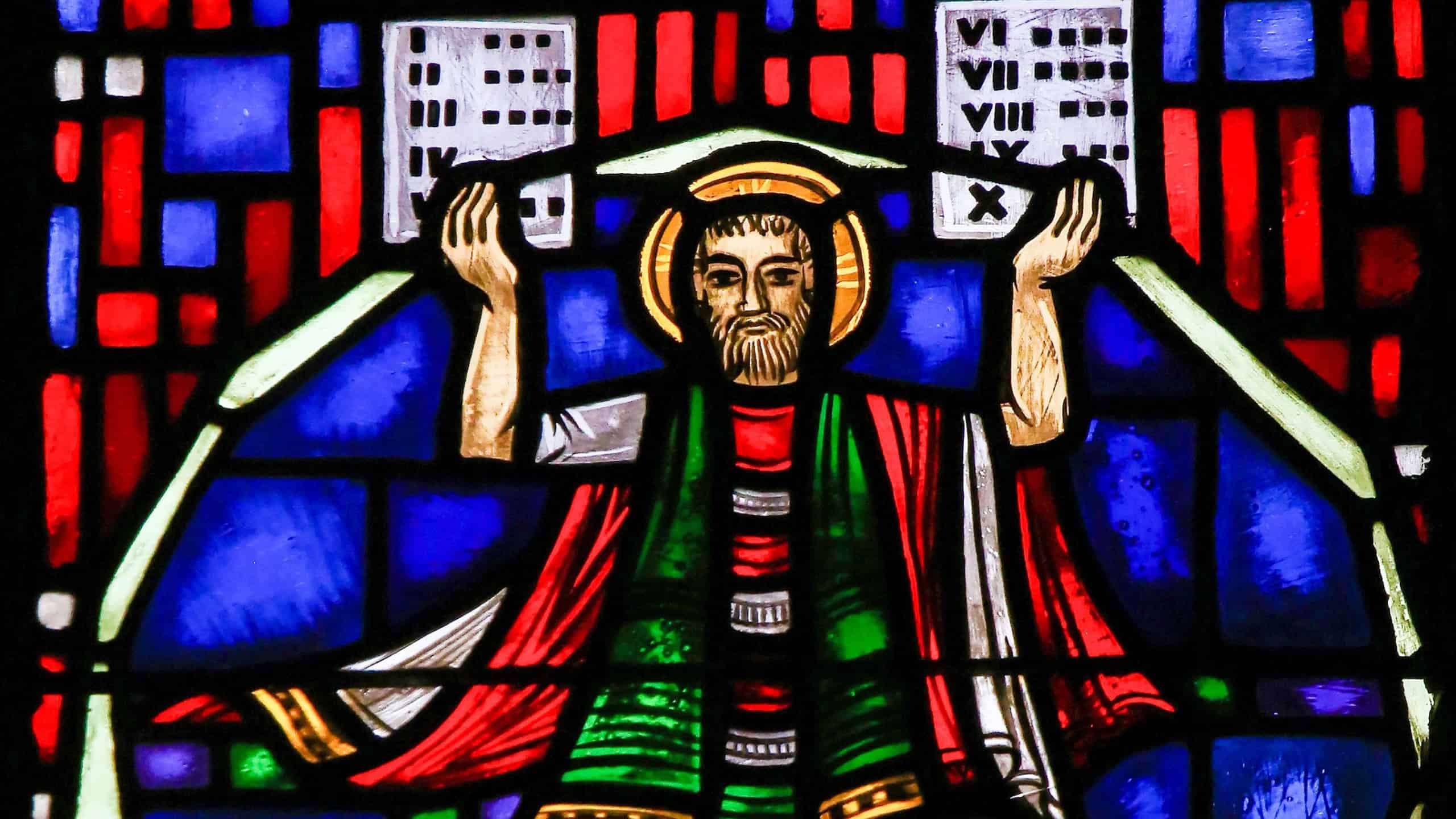 WORMS, GERMANY - JULY 4, 2017: Stained Glass in Wormser Dom in Worms, Germany, depicting Moses with the Stone Tablets and the Ten Commandments