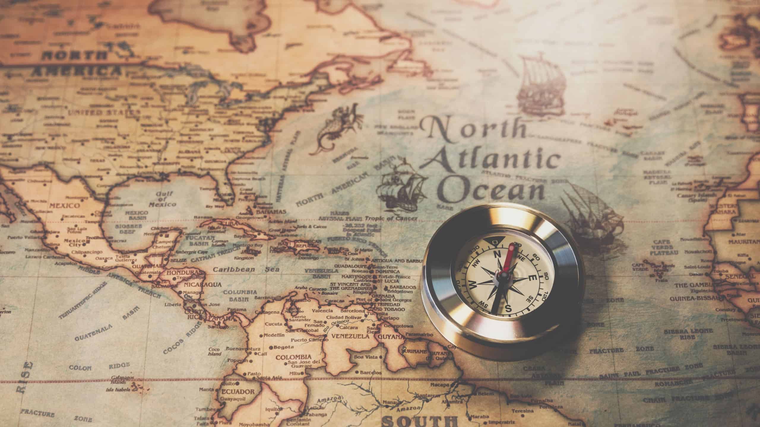 Columbus day and world map with compass