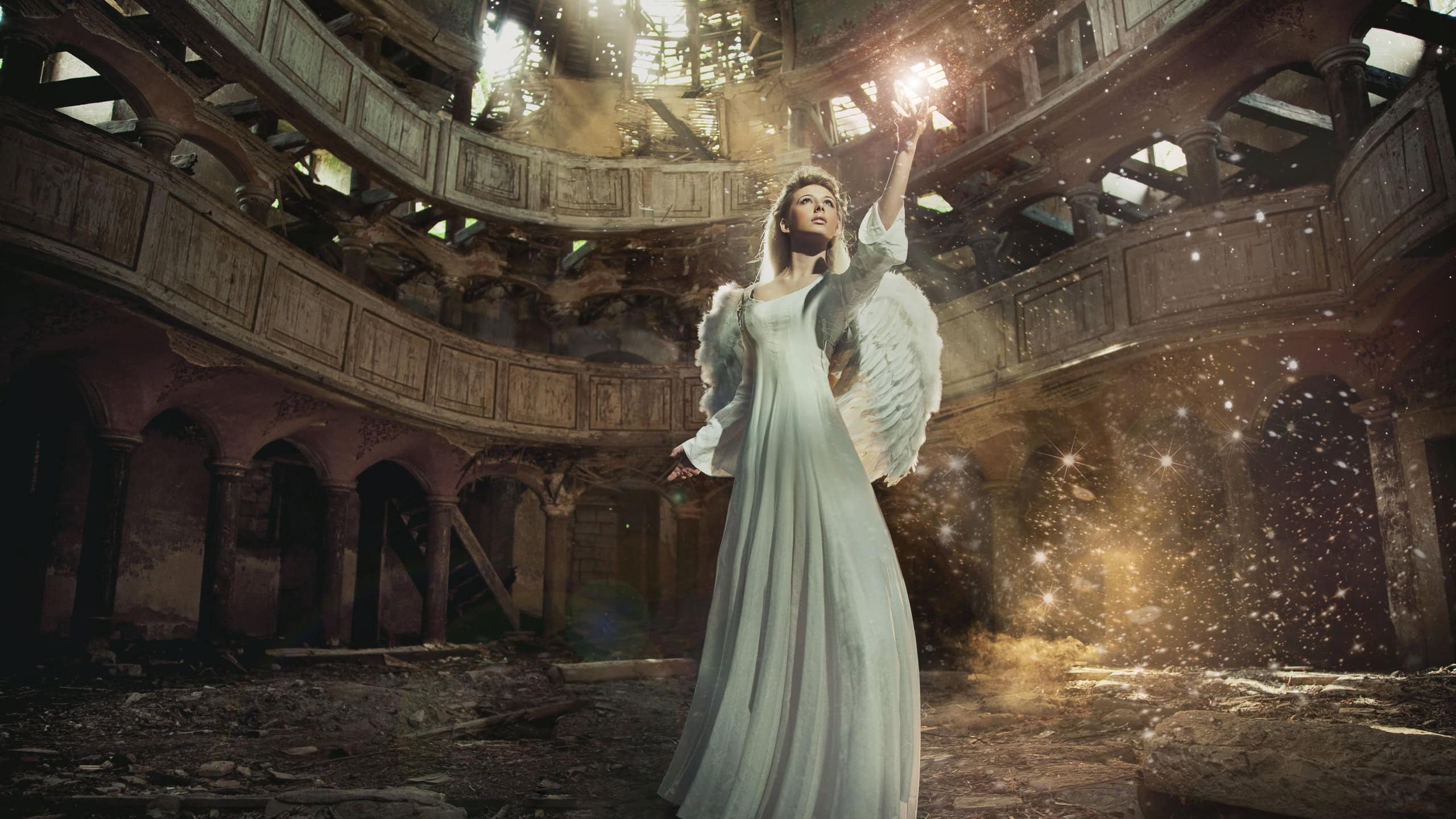 Beautiful angel among golden dust