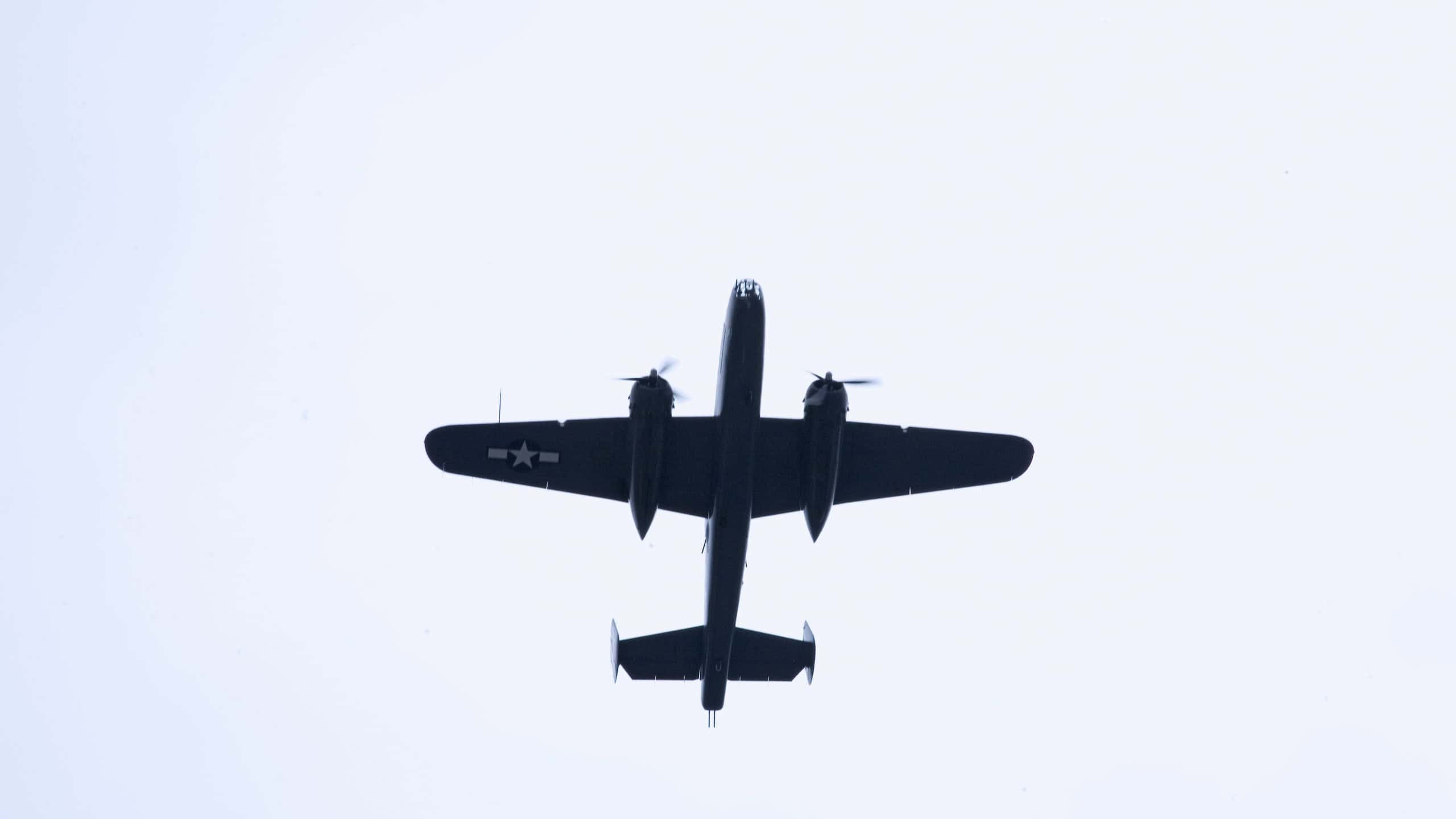Underneath North American B-25 in flight during World War II reenactment at Mid-Atlantic Air Museum World War II Weekend and Reenactment in Reading, PA held June 18, 2008