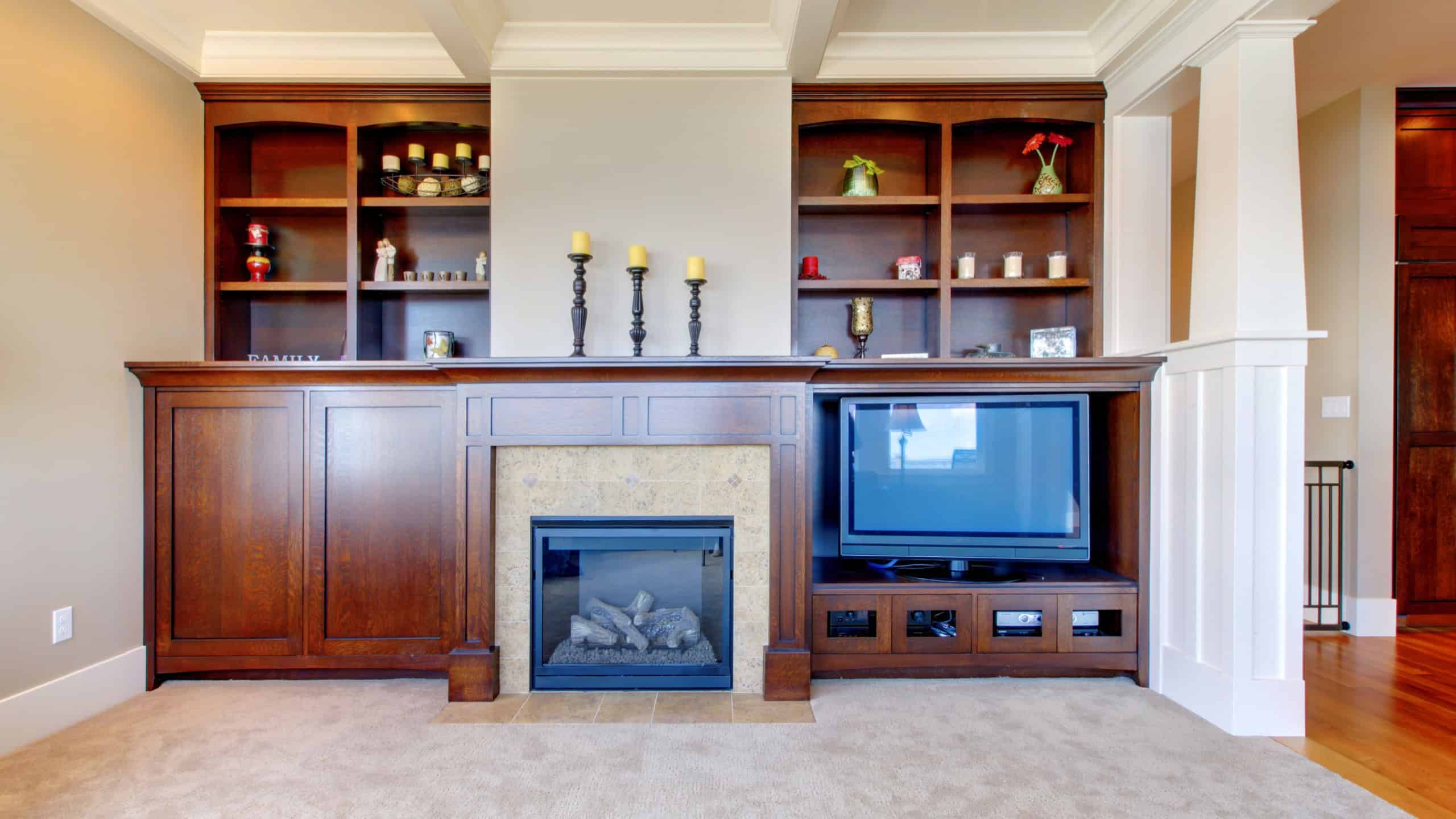 TV and entertainment center with white wood ceiling in a luxury room.