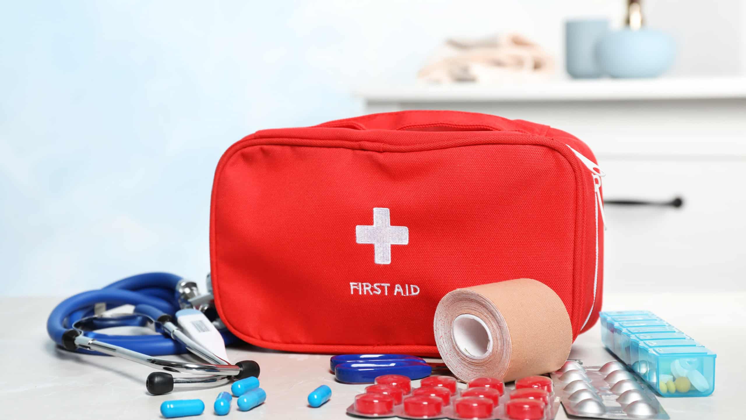 First aid kit with pills on table indoors