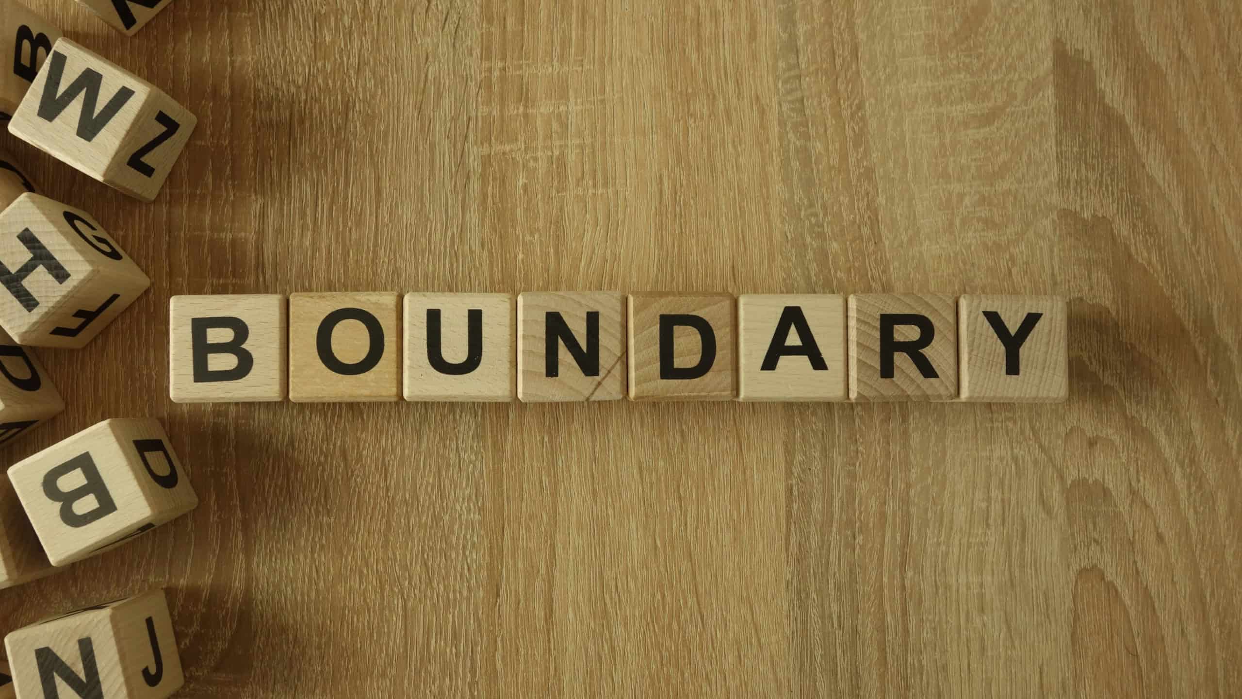 Boundary word from wooden blocks on desk
