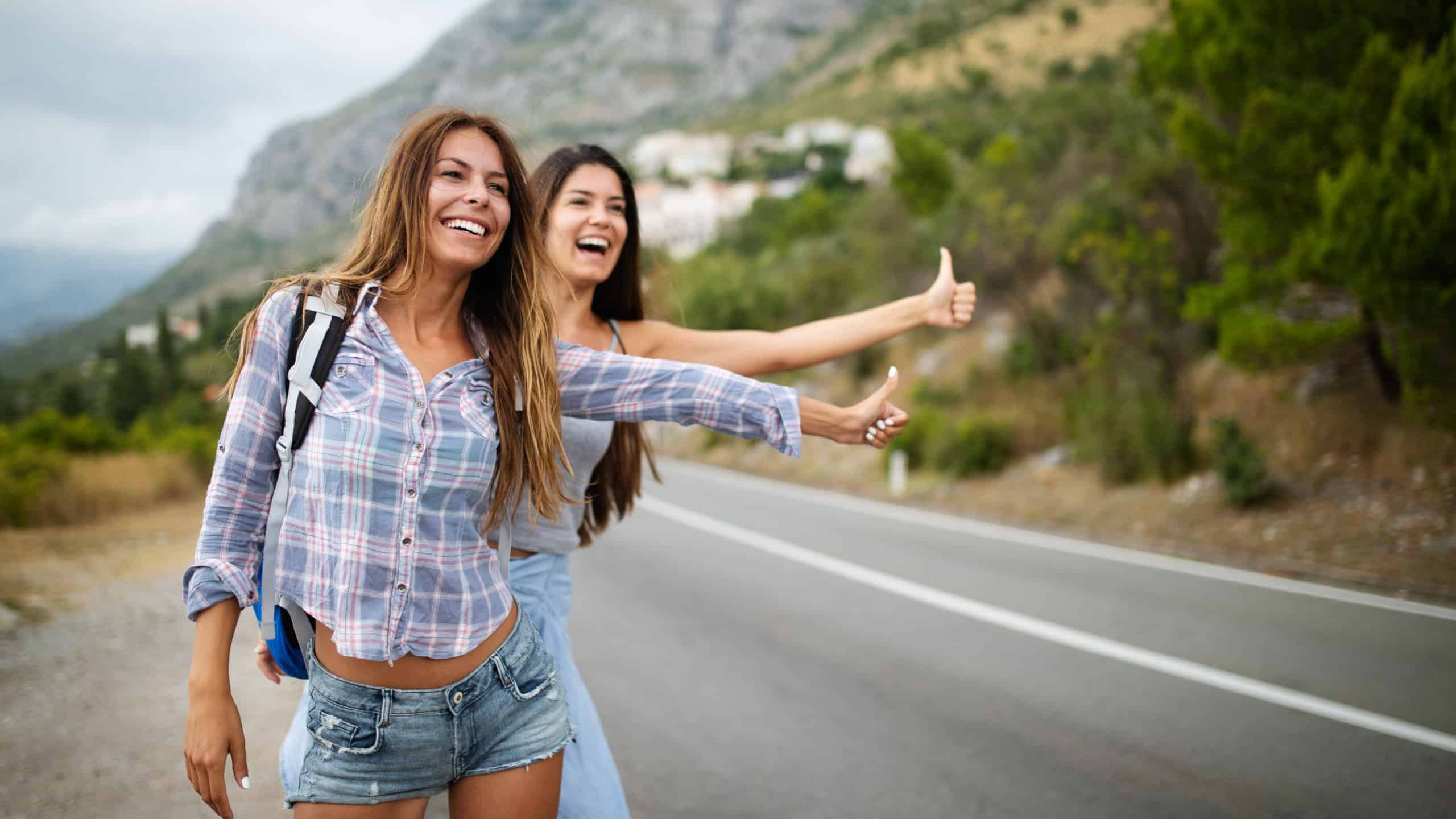 Group of backpackers and young friends traveling and having fun together