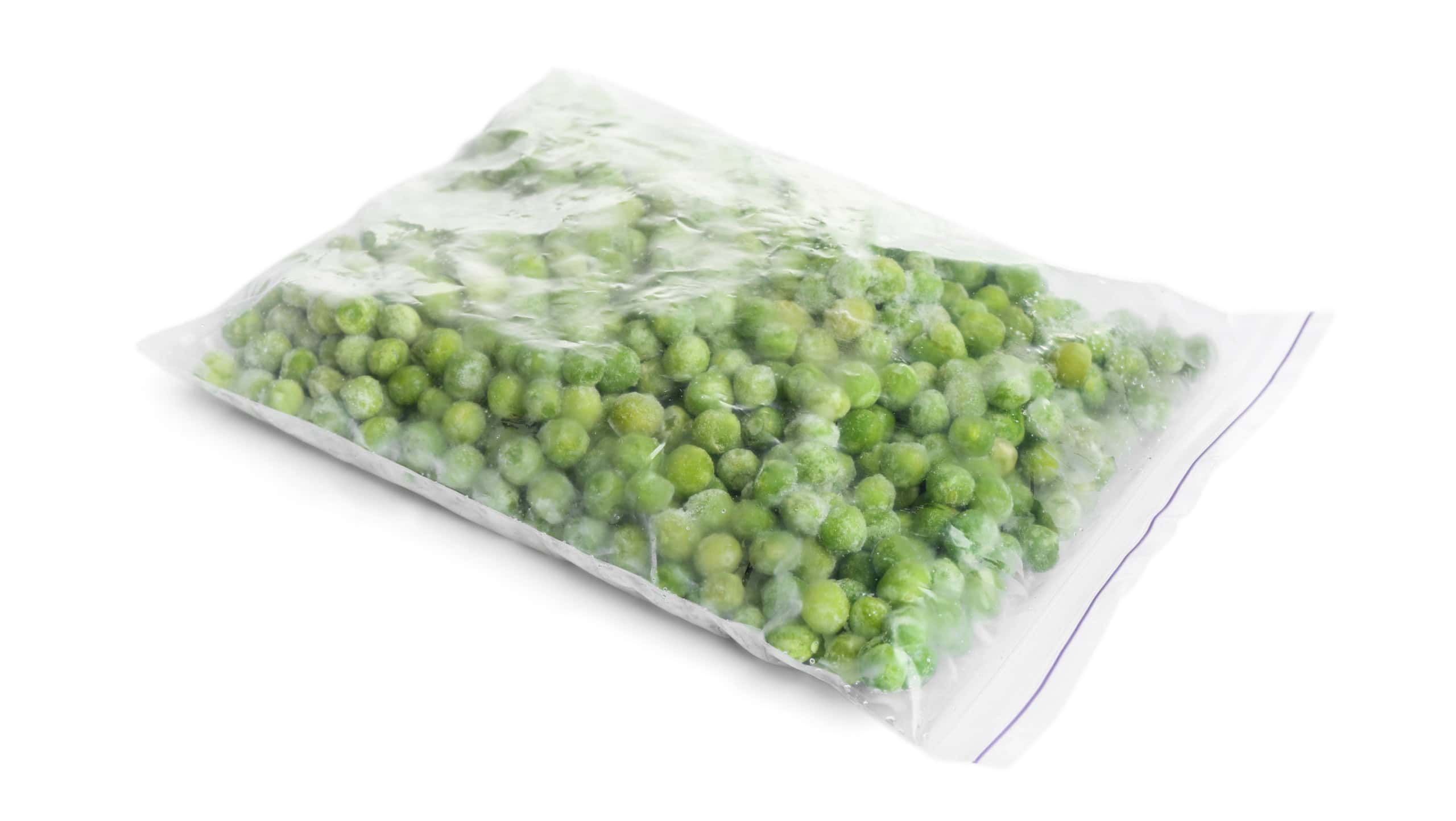 Frozen peas in plastic bag isolated on white. Vegetable preservation