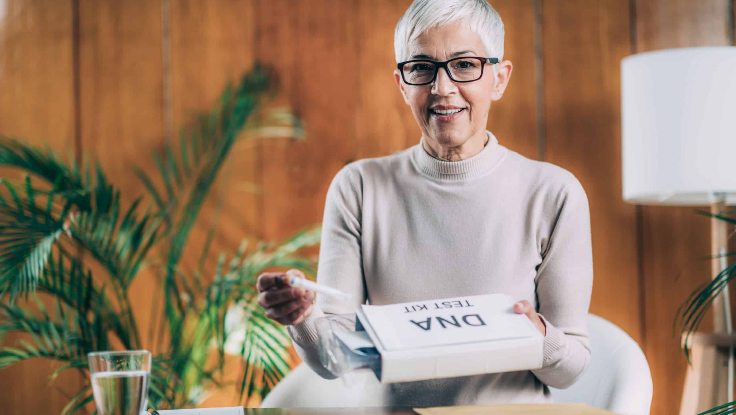 Senior Woman Preparing DNA Genetic Test Kit