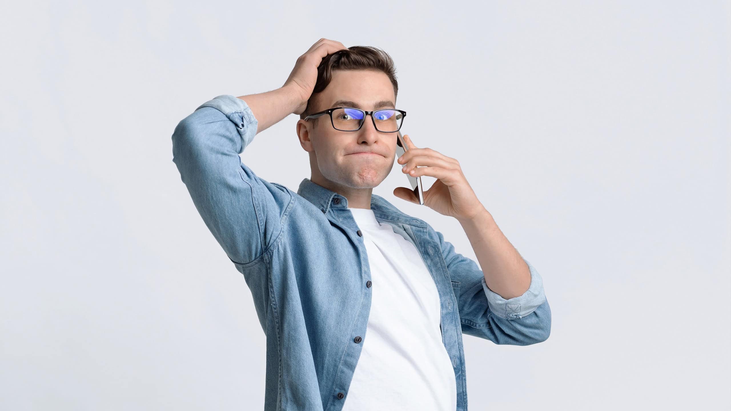 Frustrated guy tightly pressed his lips on white background