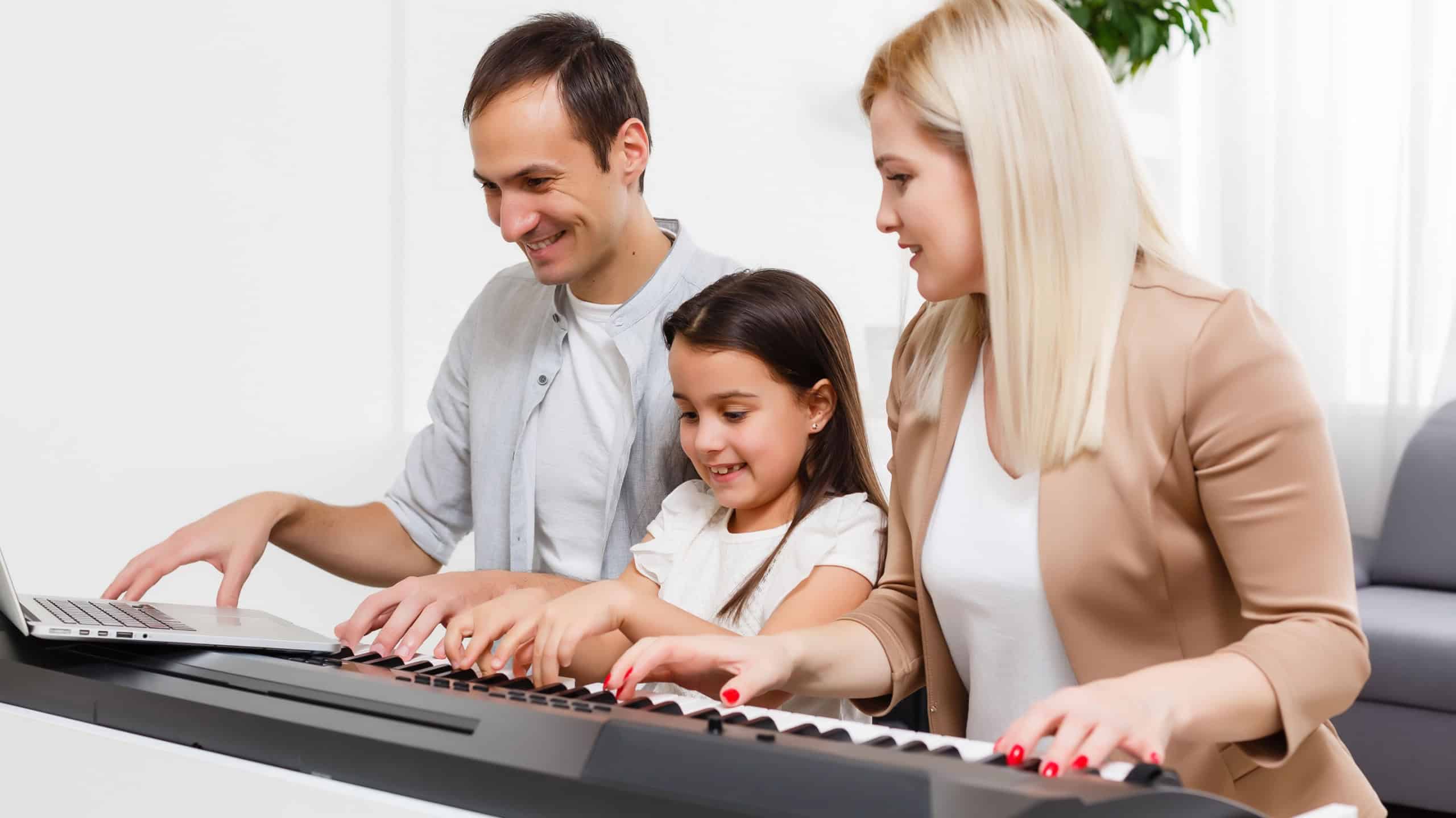 Family plays the digital Piano at home, learning online, family rest during quarantine, self-isolation, online education concept. support for loved ones concept