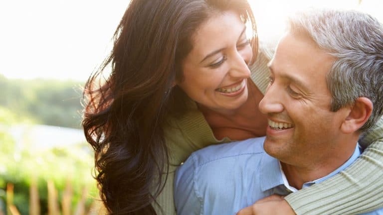 Loving Hispanic Couple In Countryside