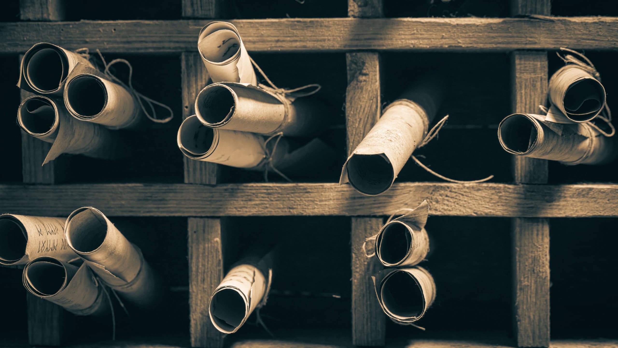 Closeup of magic library with ancient scrolls in wooden box