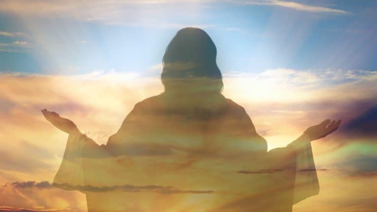 Silhouette of Jesus Christ and cloudy sky, double exposure