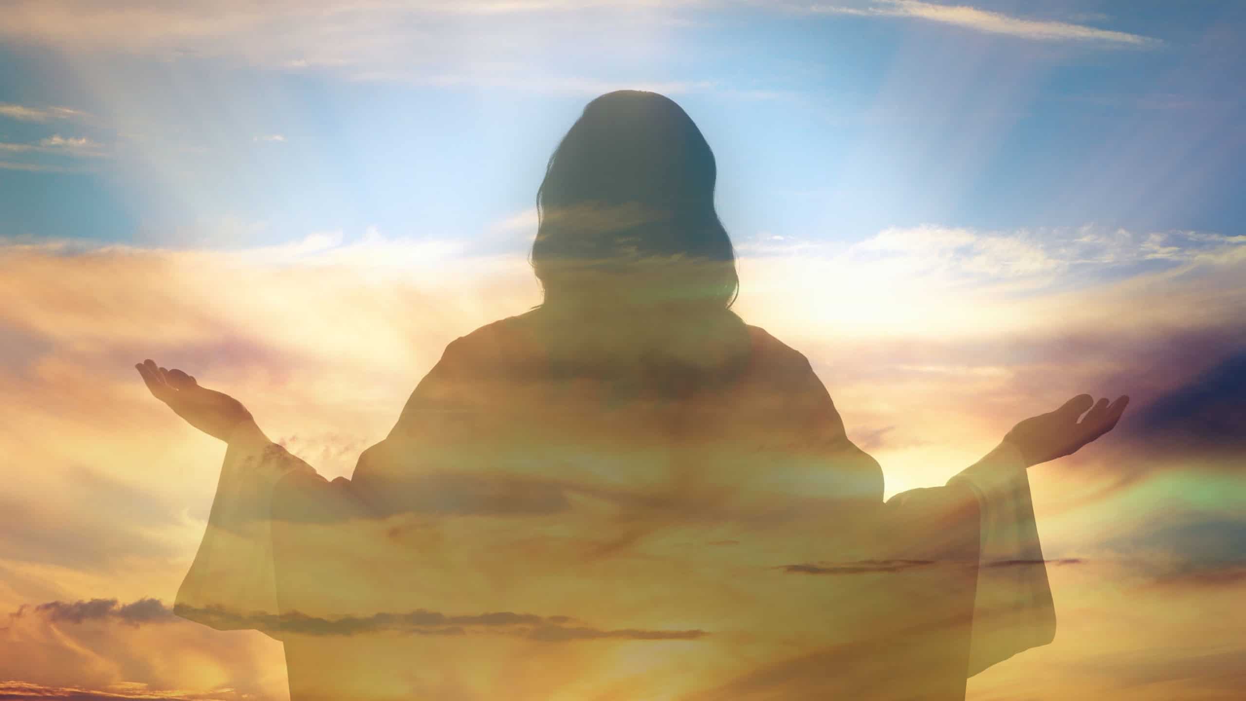 Silhouette of Jesus Christ and cloudy sky, double exposure