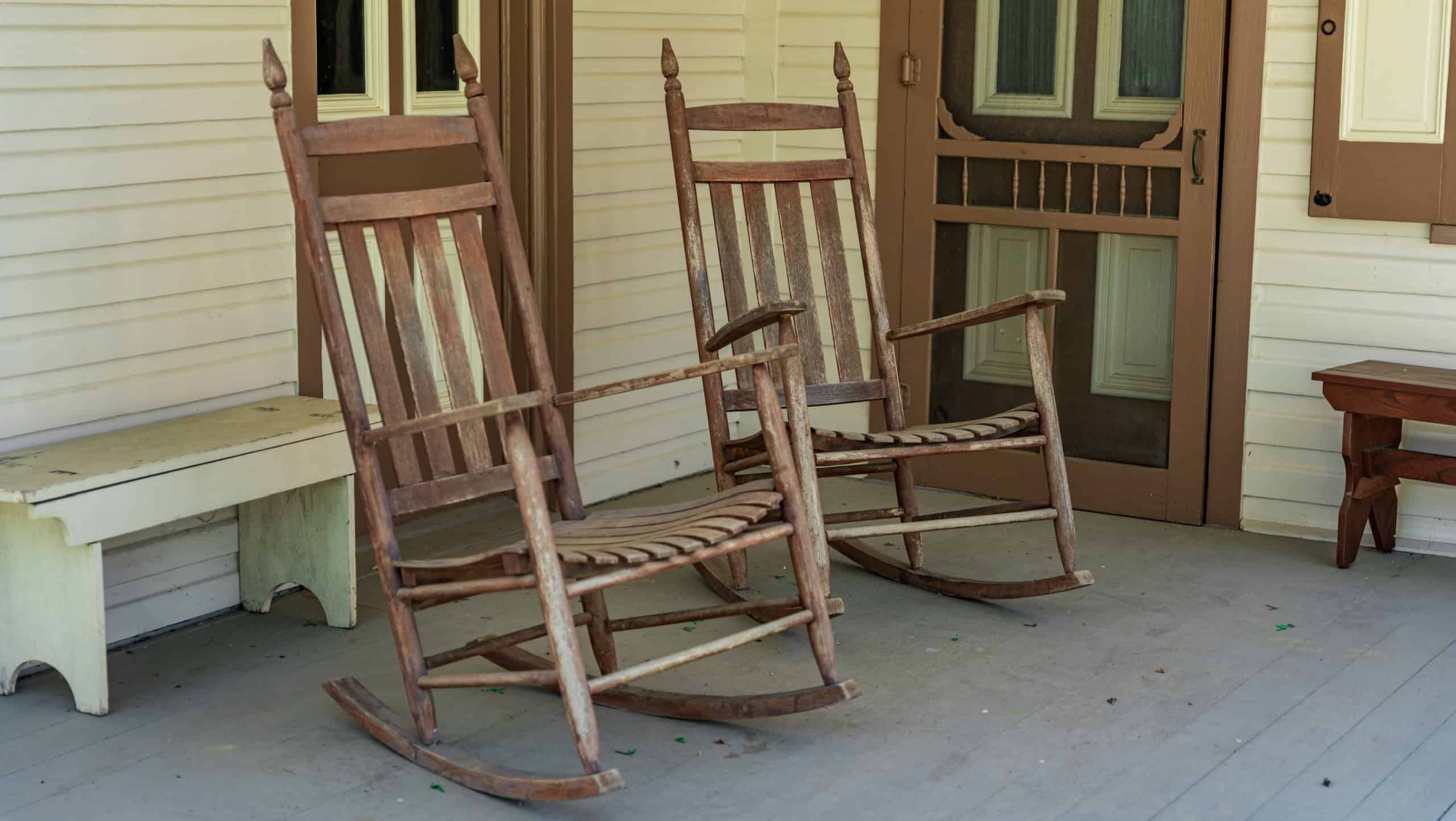 A pair of rocking chairs on a country porch.