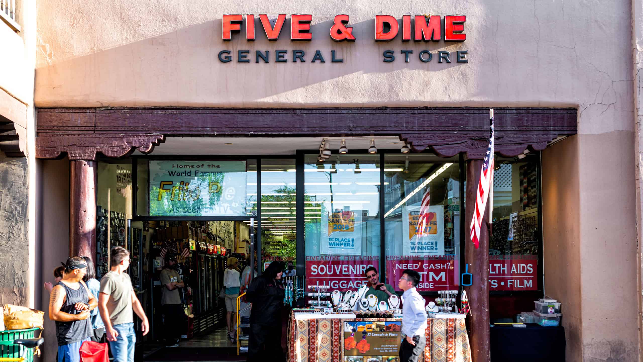Shop store sign for five and dime on old town street in United States New Mexico city with adobe style architecture