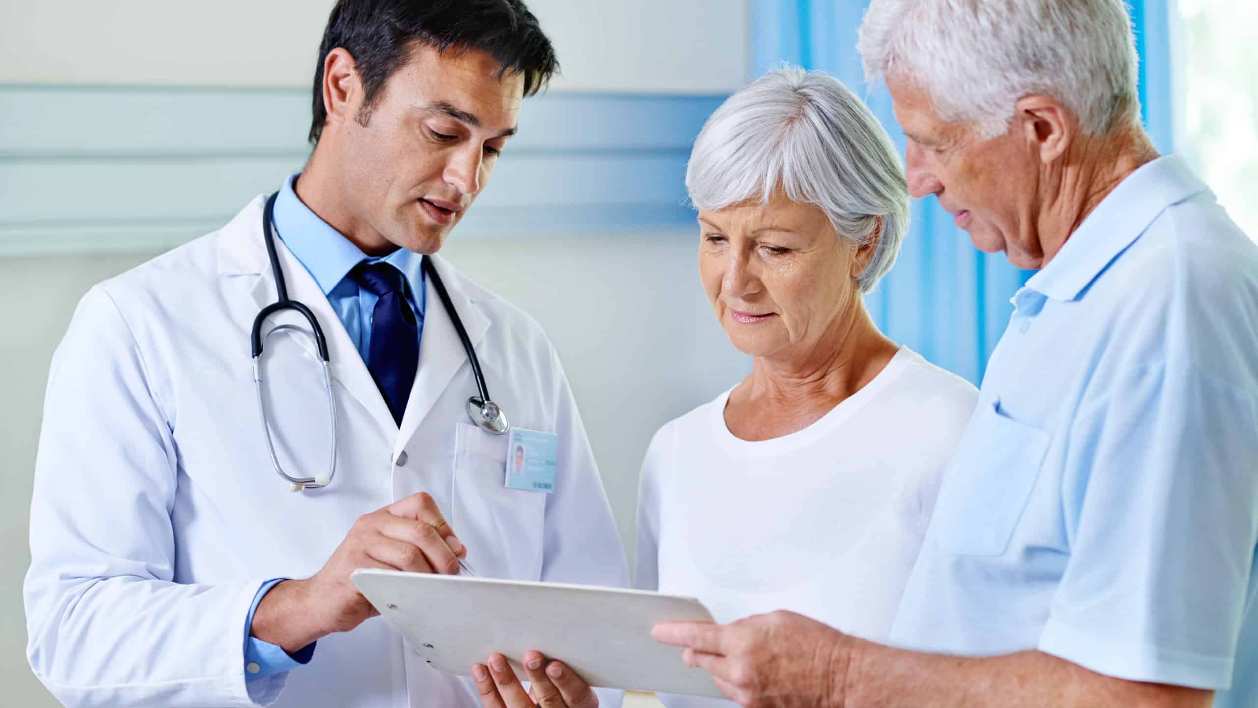 Thats completely within normal range. Shot of a handsome young doctor explaining results to a senior couple.