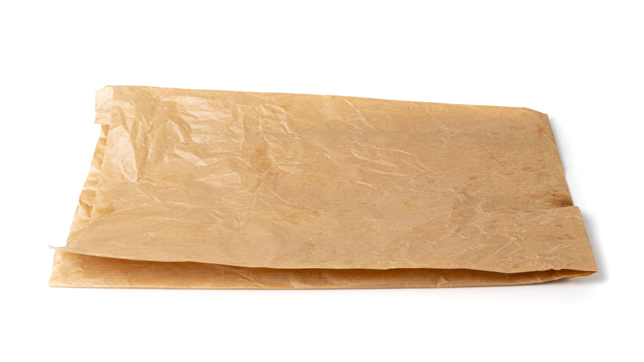 Old paper bag isolated. Crumpled disposable ecology container, wrinkled paperbag, kraft paper bag on white background
