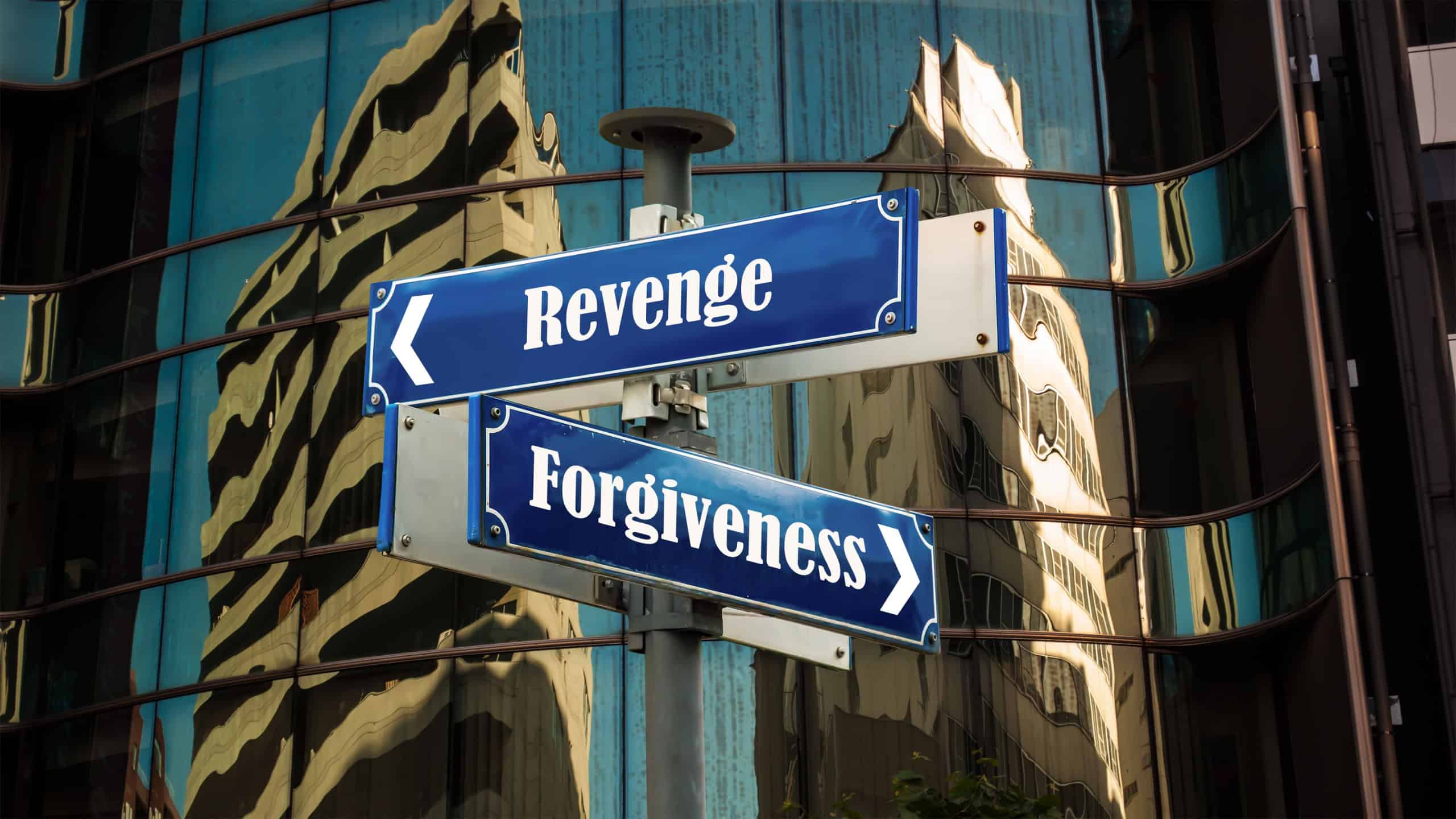 Street Sign the Direction Way to Forgiveness versus Revenge