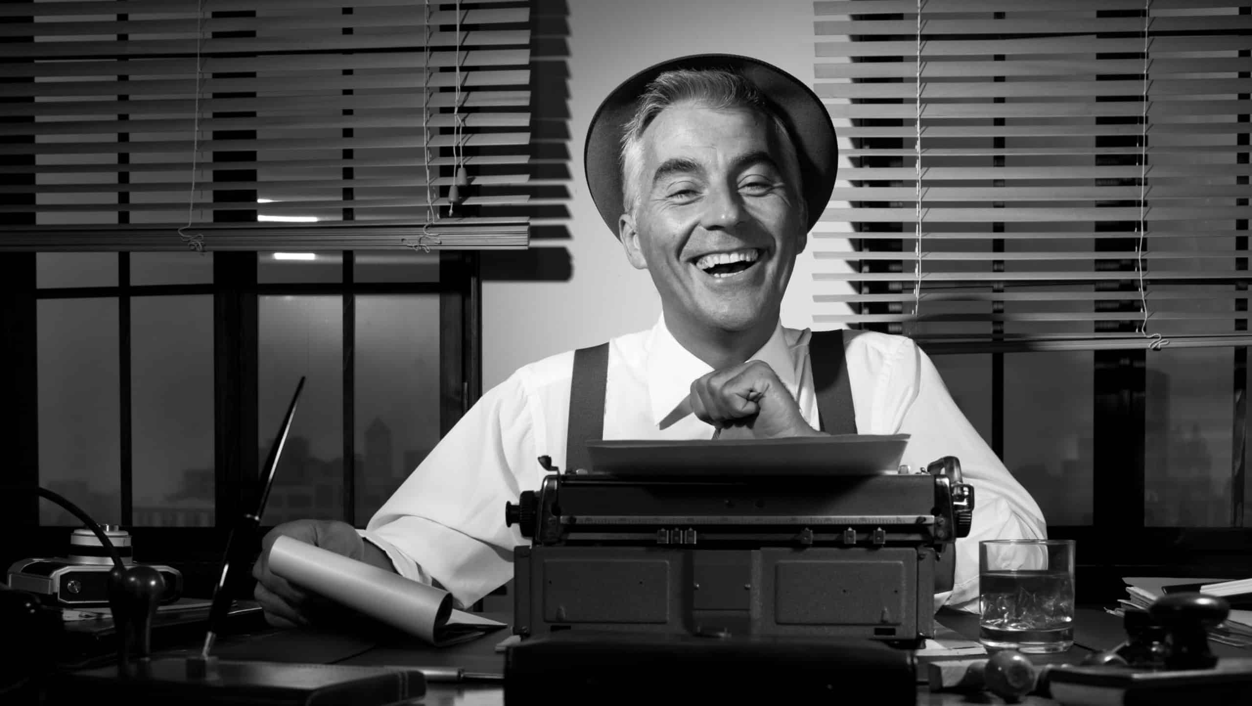 Professional reporter at work writing down notes, 1950s style office.