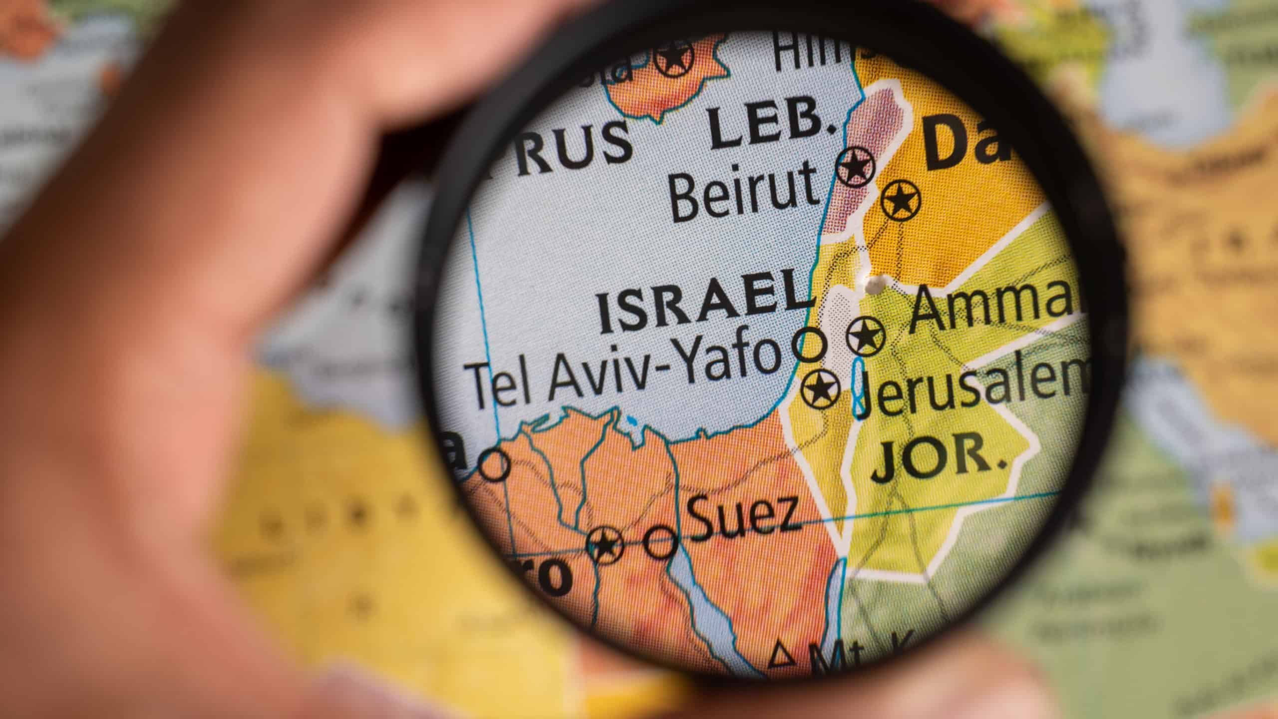 Exploring Israel location on a map under magnifying glass