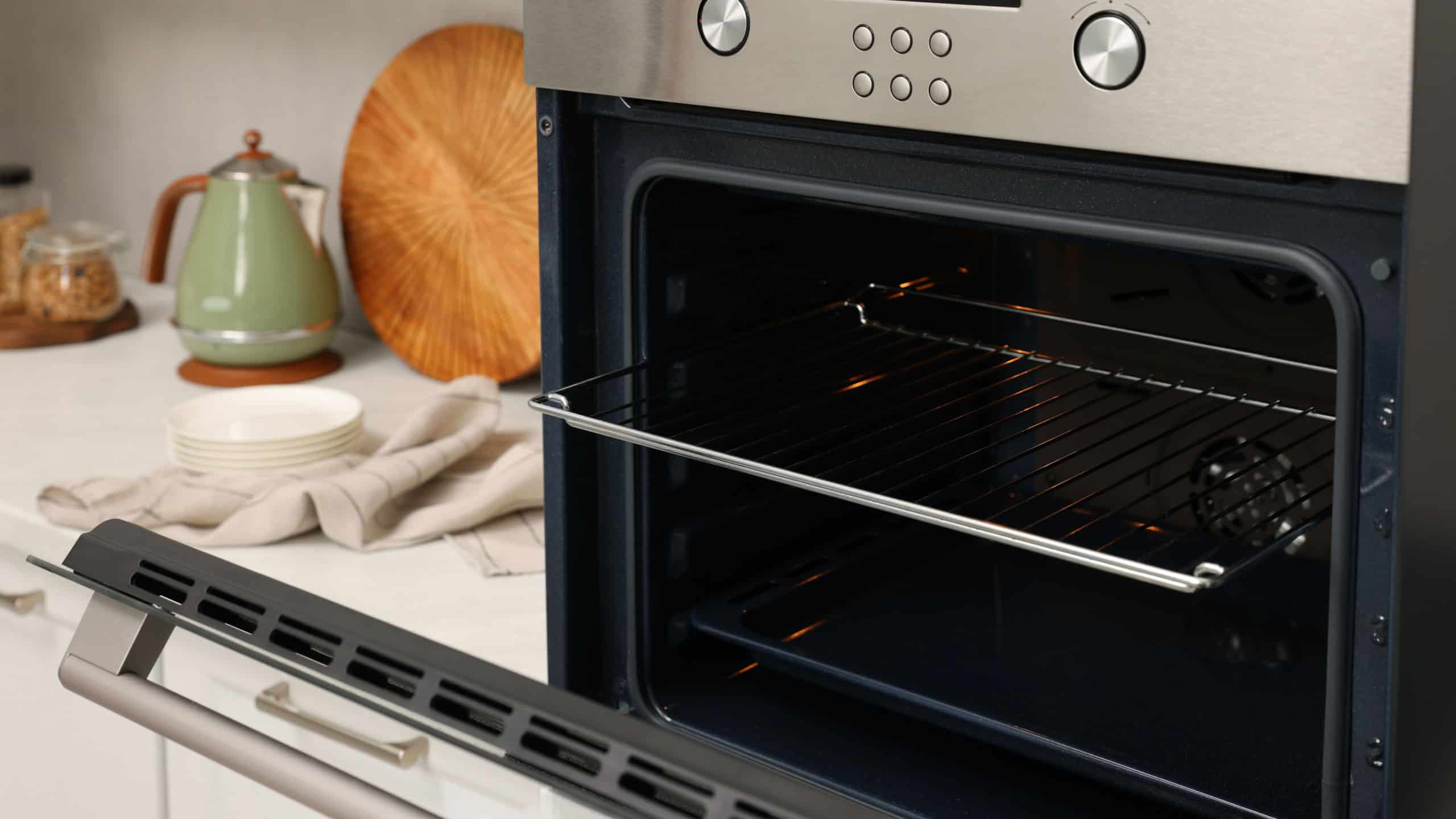 Open electric oven in kitchen. Cooking appliance
