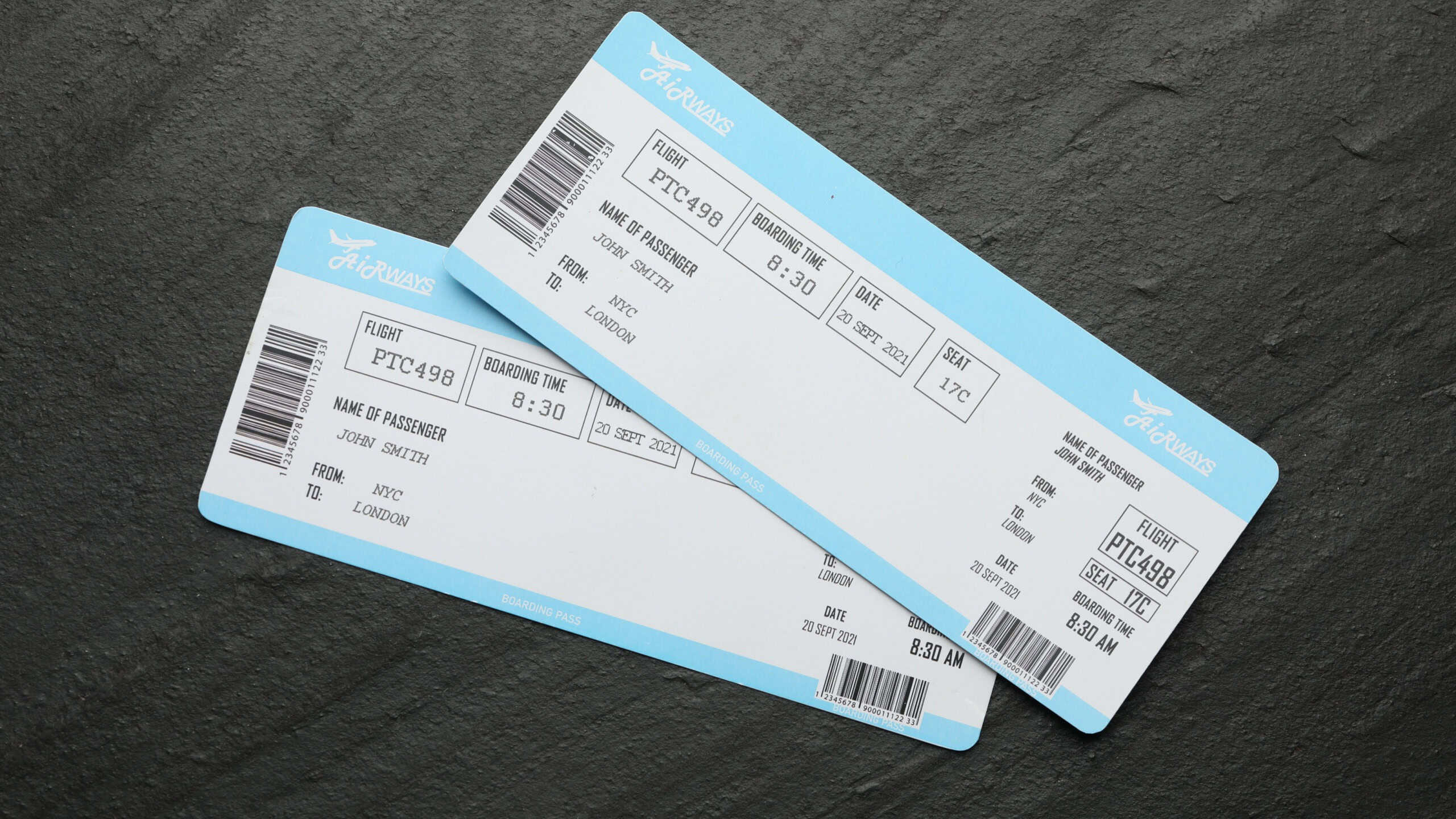 Travel agency. Flight tickets on dark textured table, top view