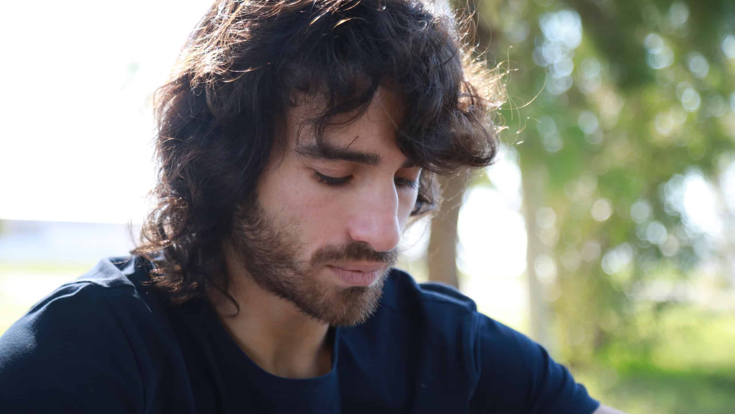 Sad Long Hair Man Is About To Cry From Depression In The Nature Park