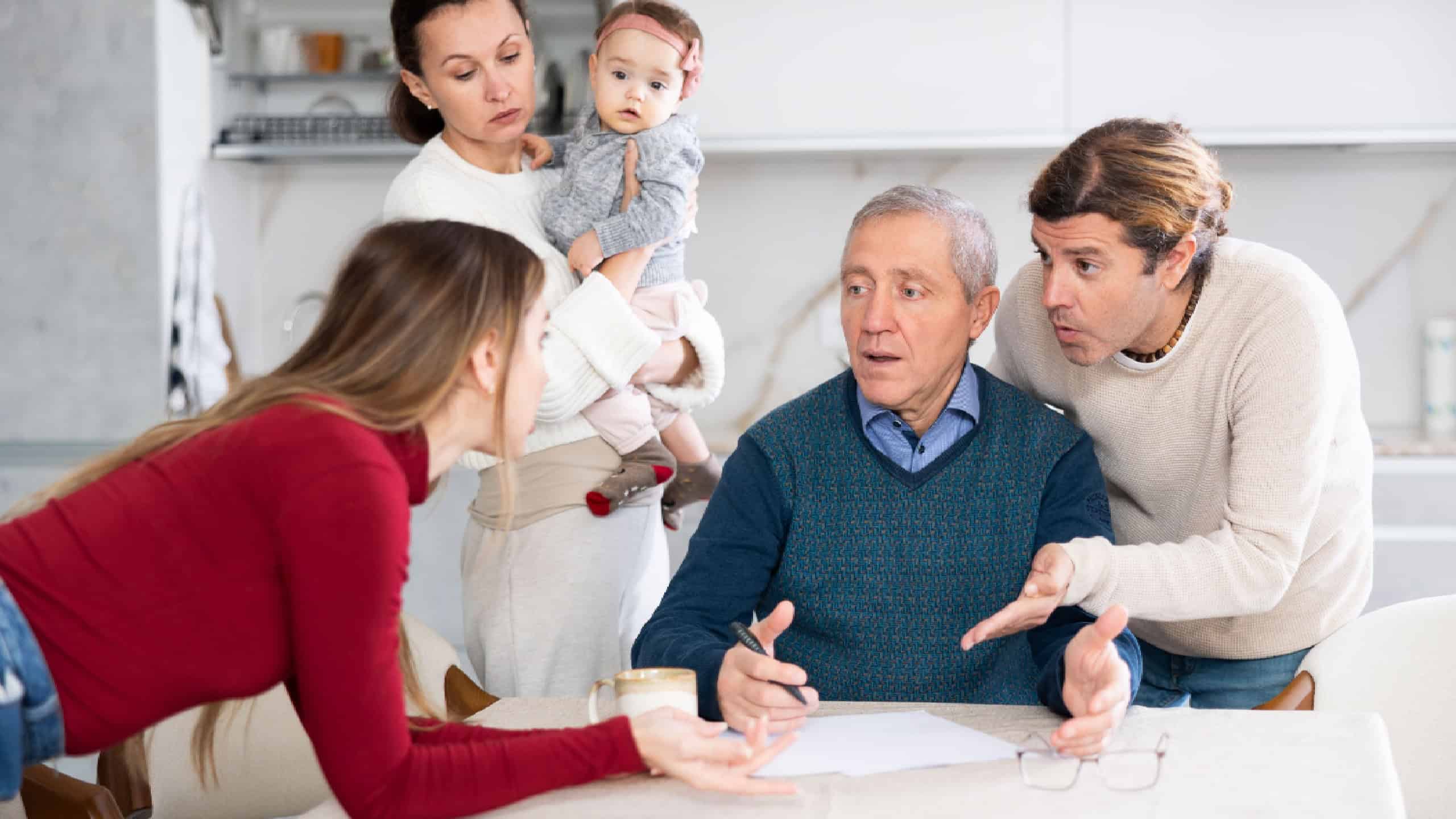 People of different generations argue with each other and show an elderly father how to fill out documents correctly