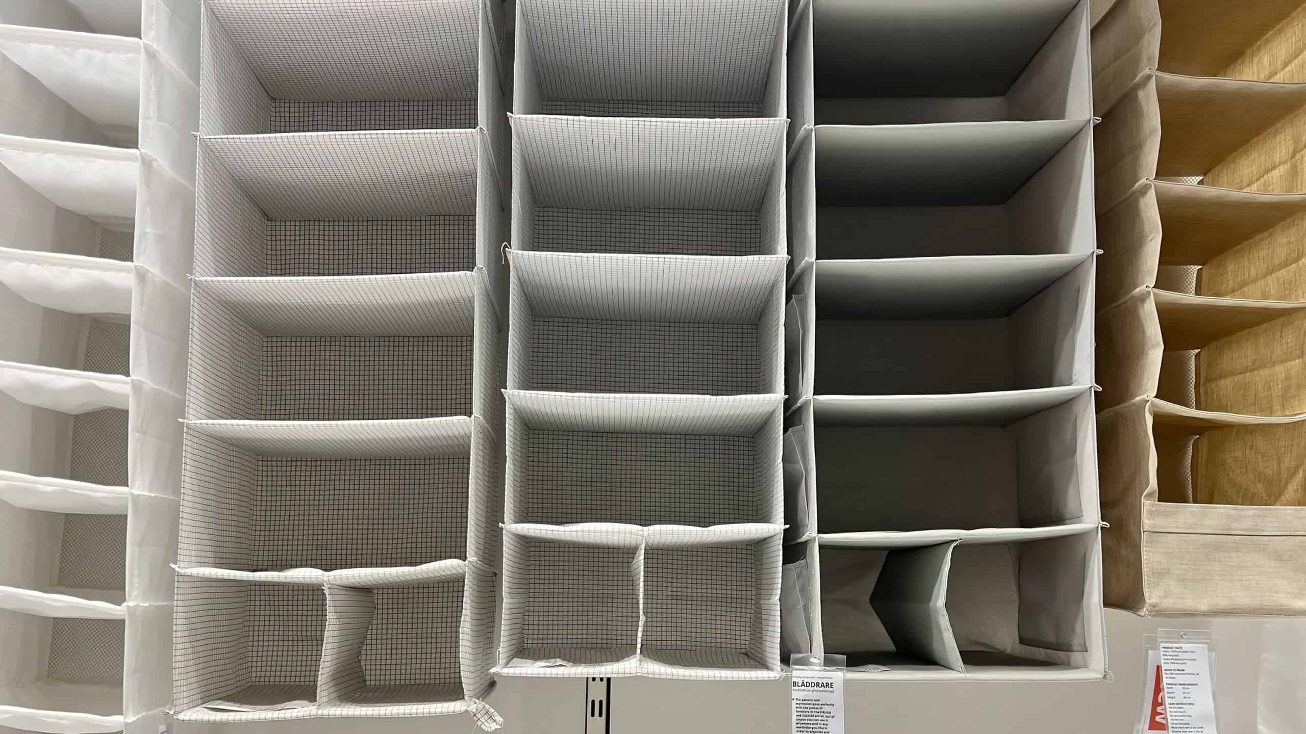 Hanging fabric storage organizers displayed on rack in store