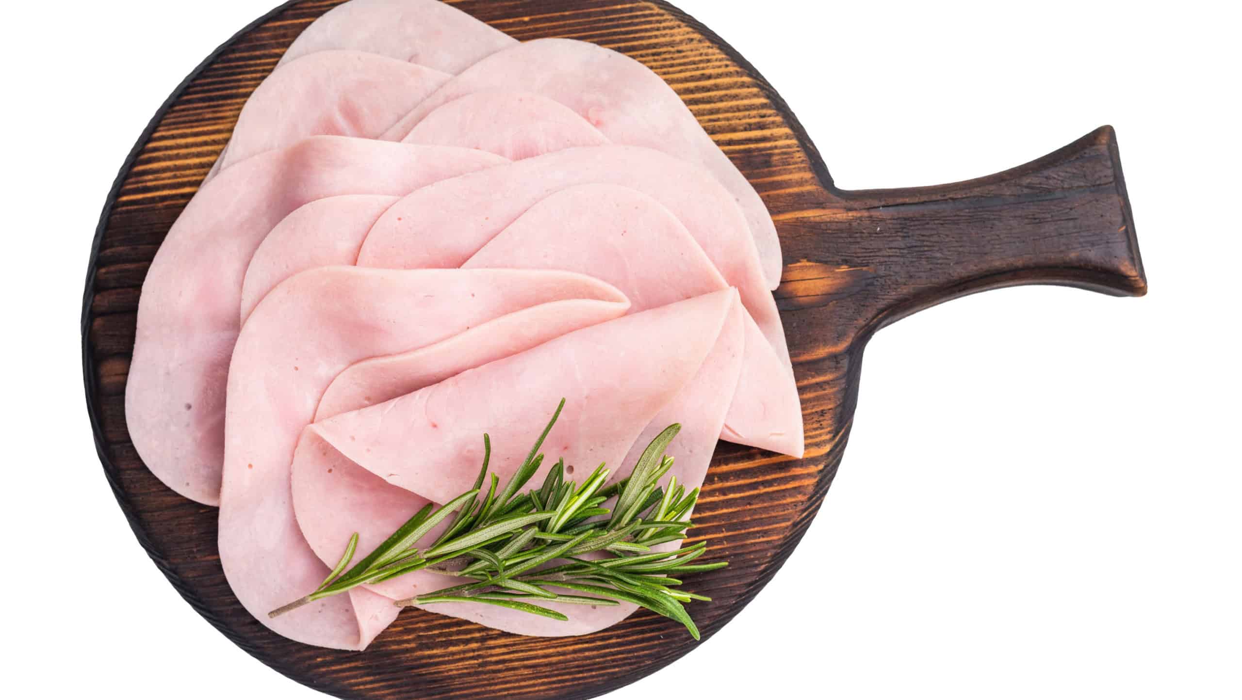 Close up of savory sliced ham showcasing its rich color and texture, a must-have for any deli lover. isolated on white background. top view.