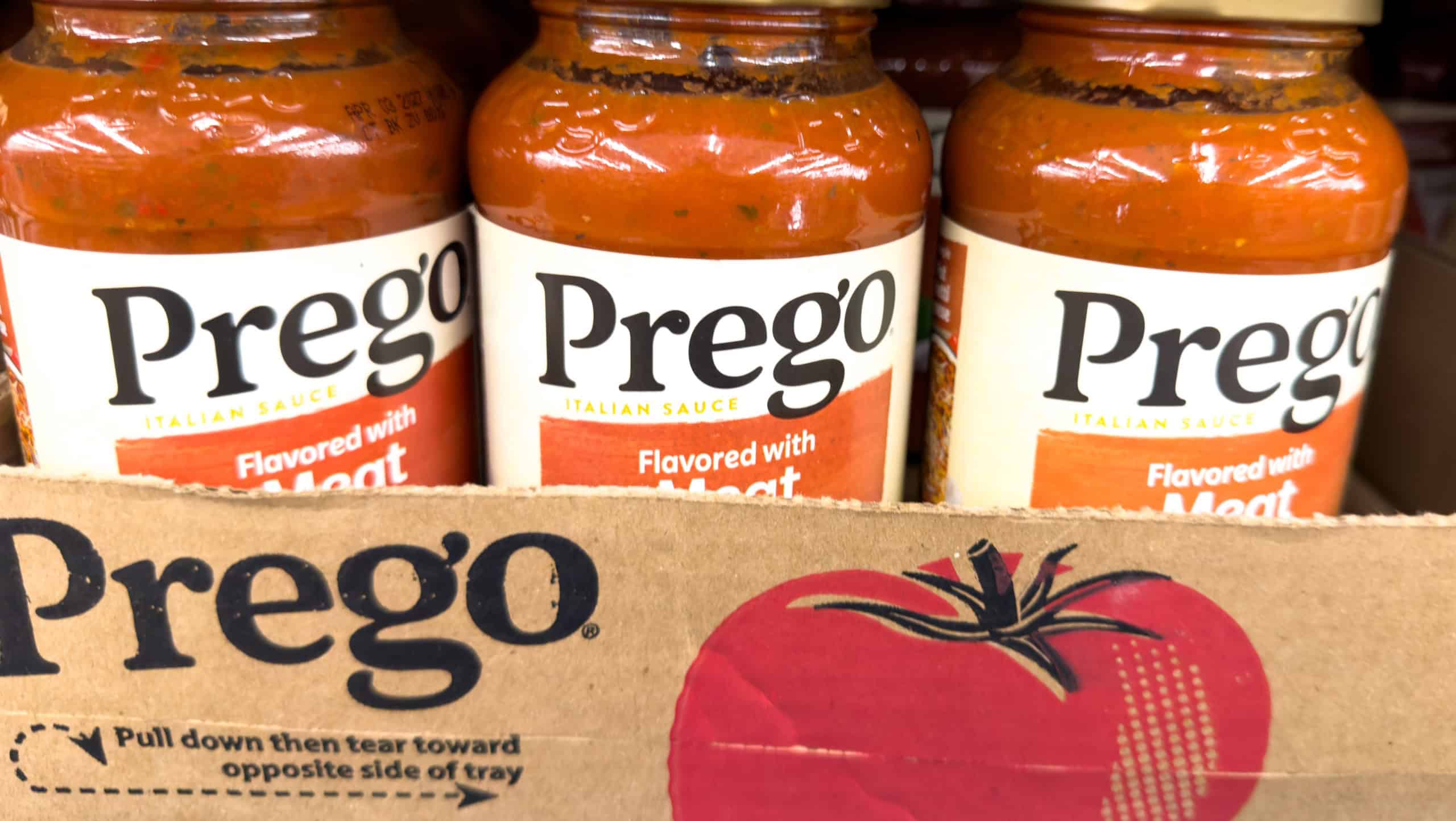San Jose, CA - February 12, 2026: Prego Flavored with Meat Pasta Sauce Jars on Grocery Store Shelf.