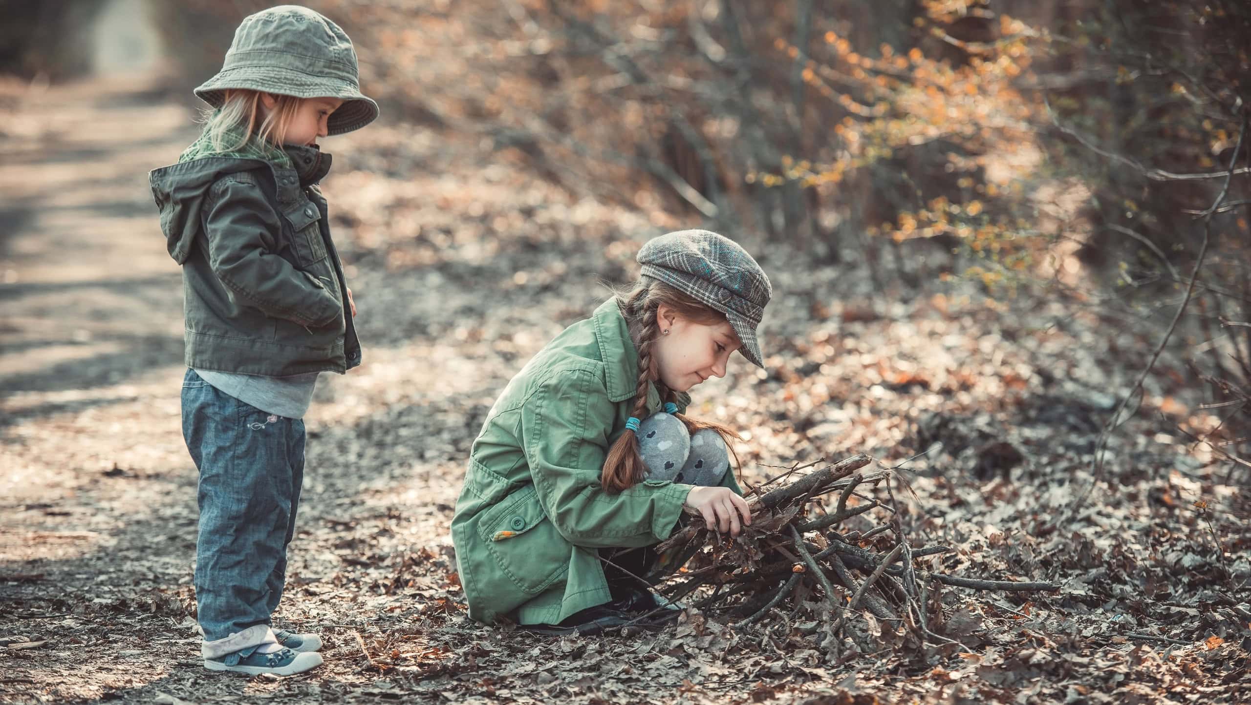 small children play in the woods, photo in vintage style