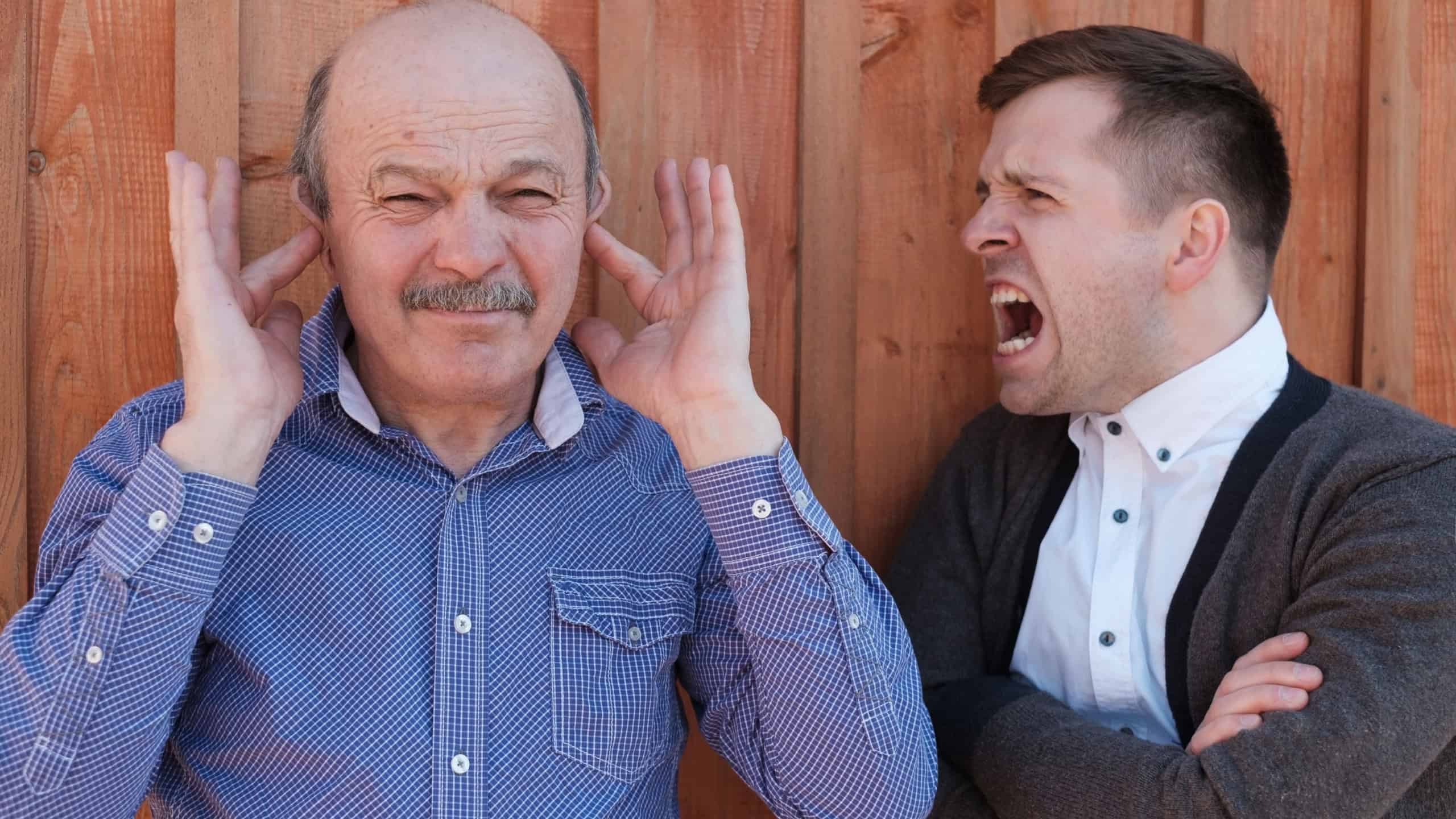 Problem in relations between generations. Young man shouts on his father-in-law