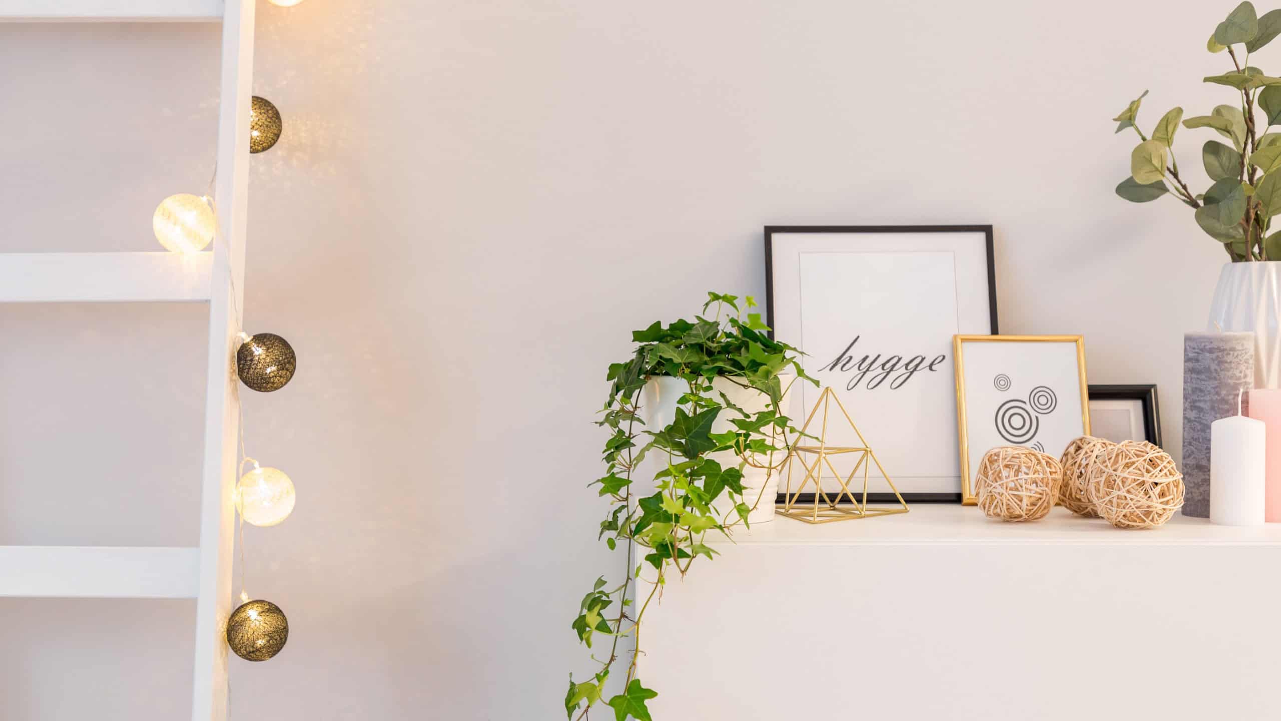Home interior in scandinavian style with white cabinet, ladder and led balls