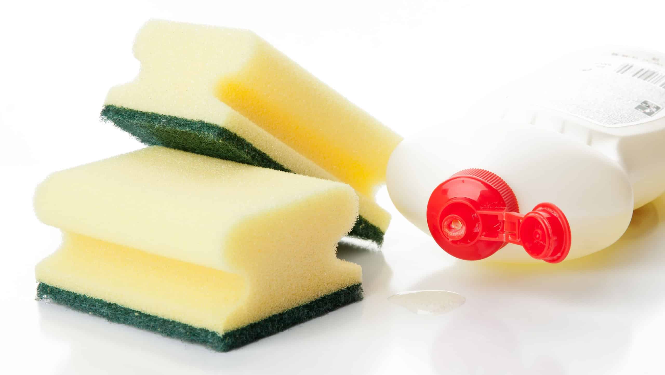 Yellow kitchen sponges and bottle of dishwashing liquid