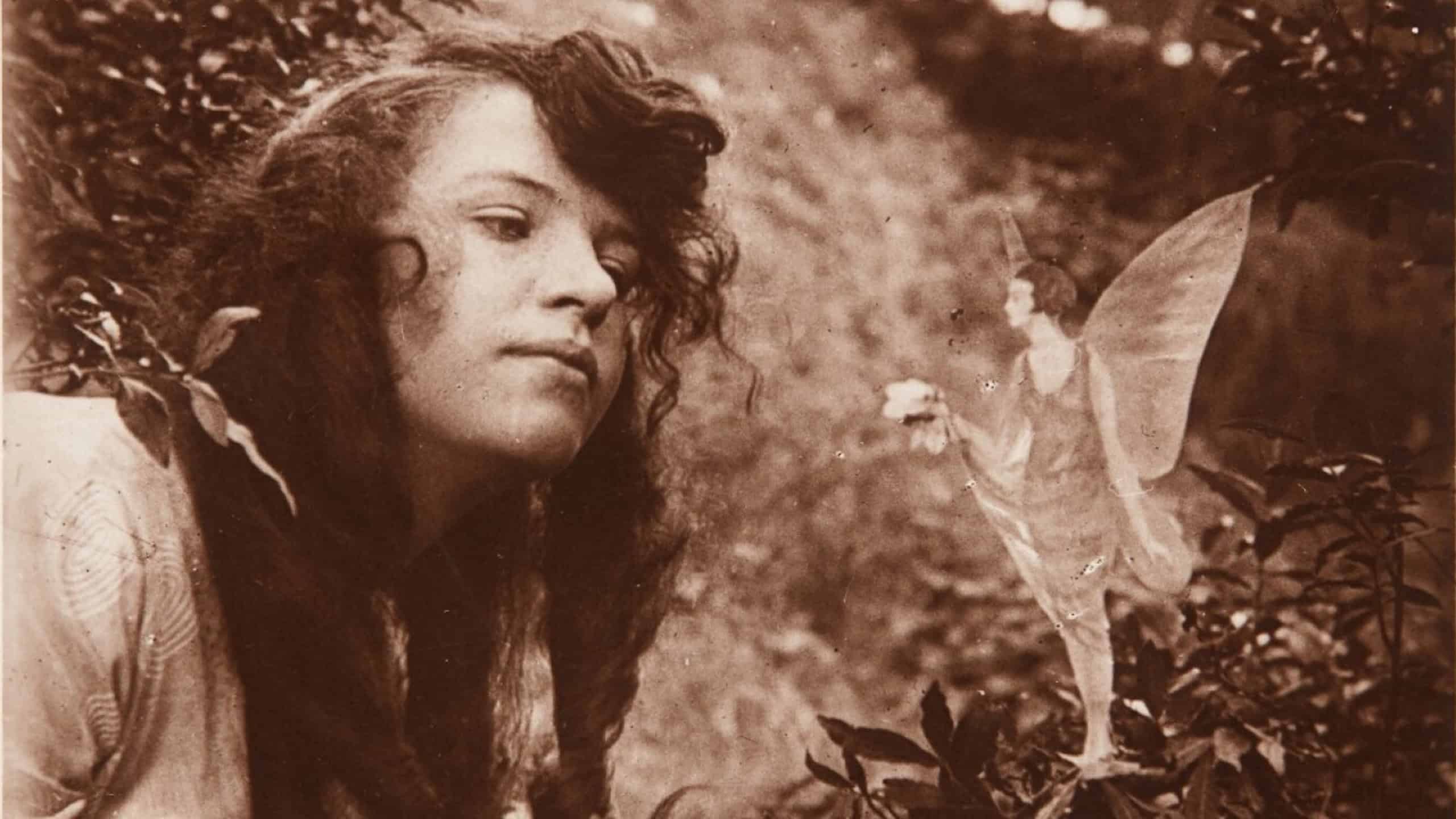 The fourth of the Cottingley Fairies photographs, showing Elsie Wright with a fairy