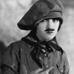 Skeptical woman in mans clothes