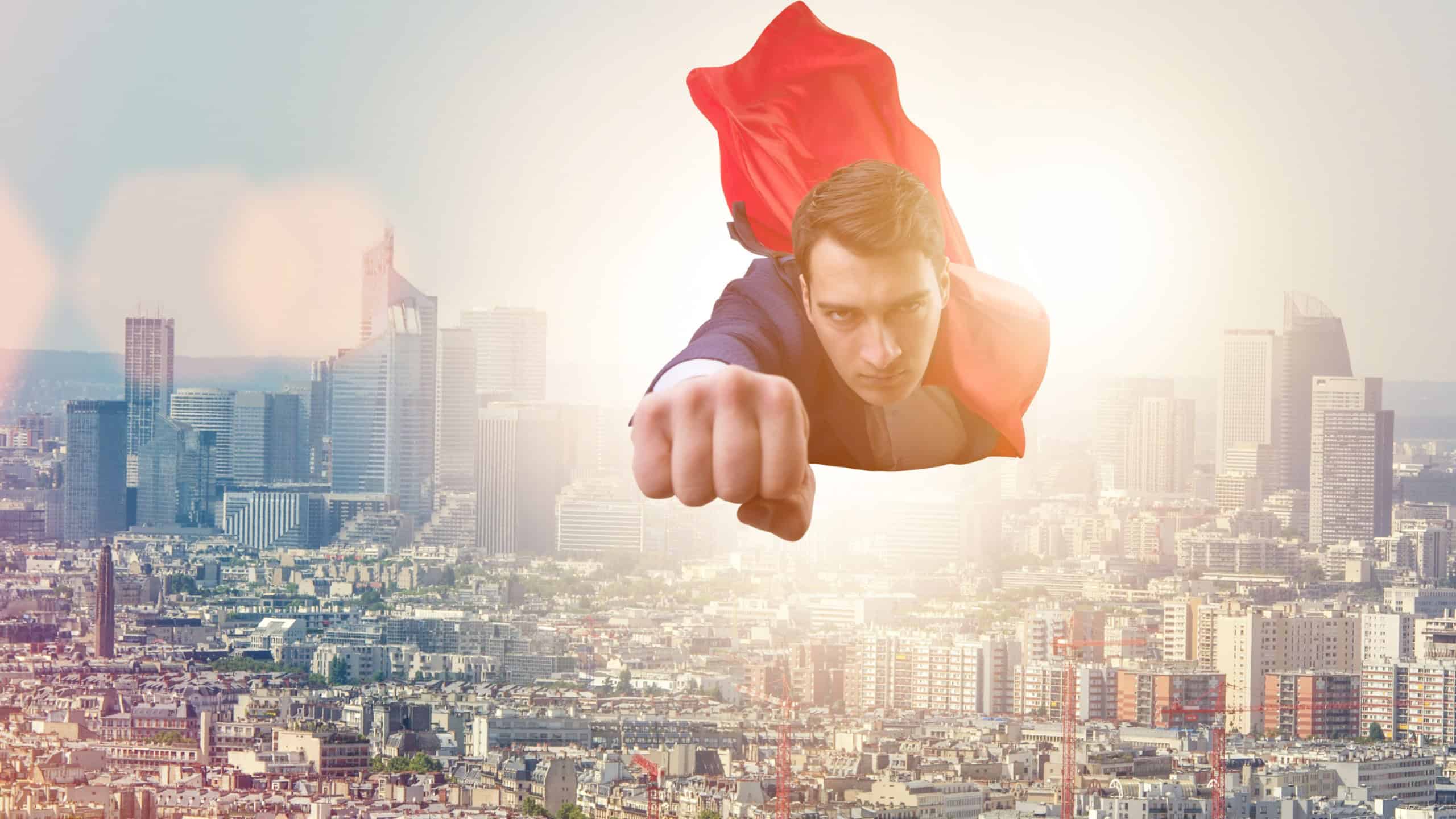 Superhero businessman flying over the city