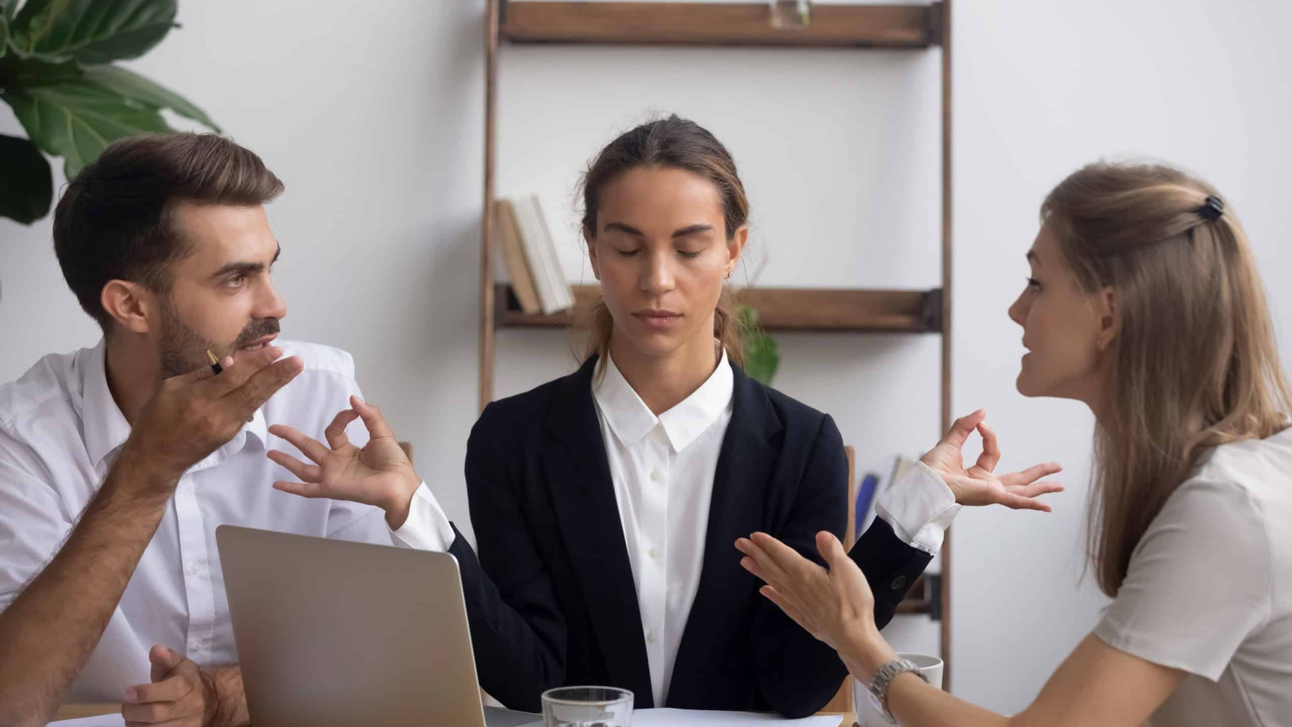 Managing stress at work concept, calm office worker meditating at workplace ignoring arguing colleagues at stressful meeting, business conflicts, peace of mind, patience control and mental health