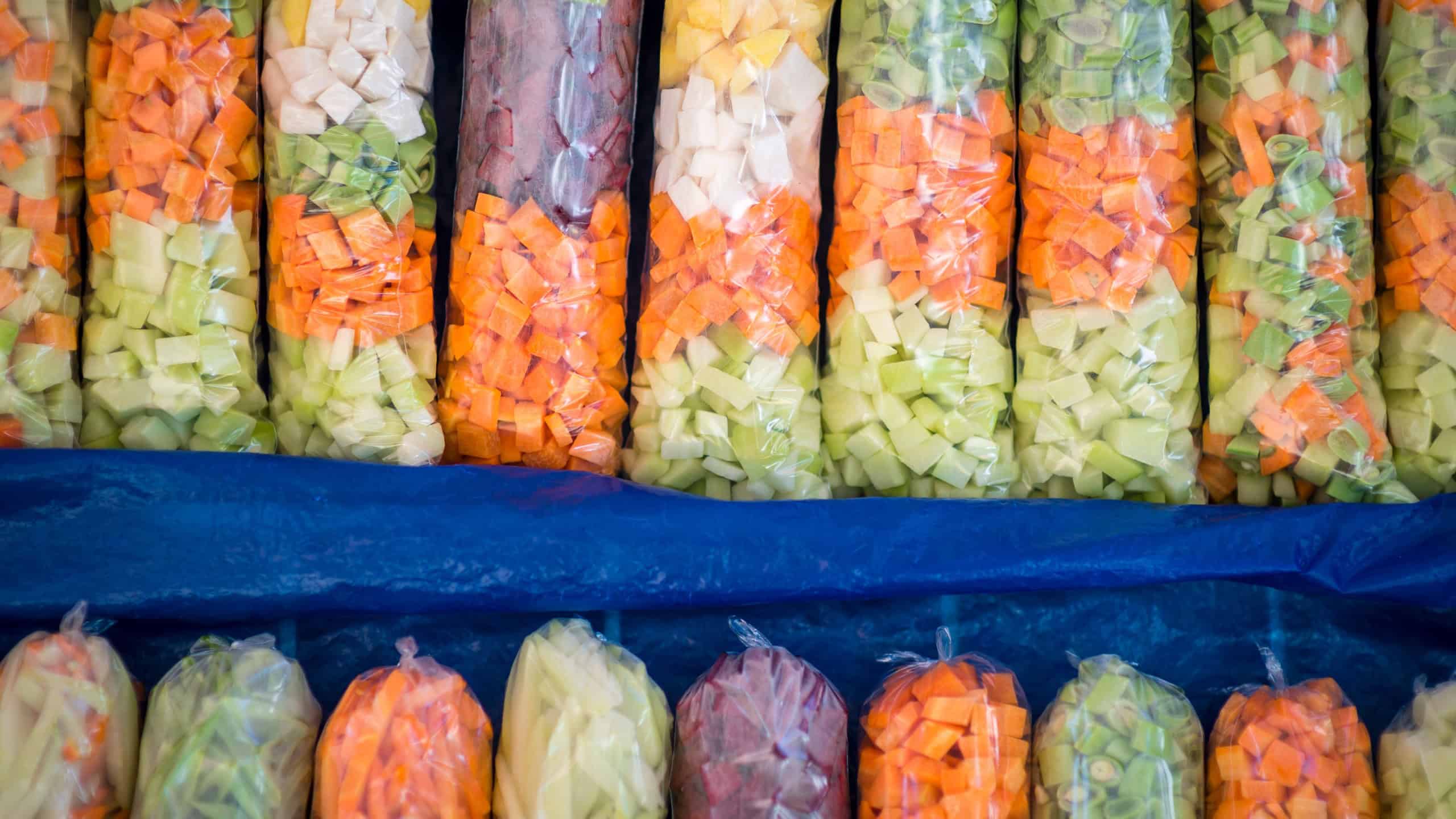 Full frame close-up of colorful sacks of fresh grated vegetables on display at a farmers market in Rio de Janeiro, Brazil