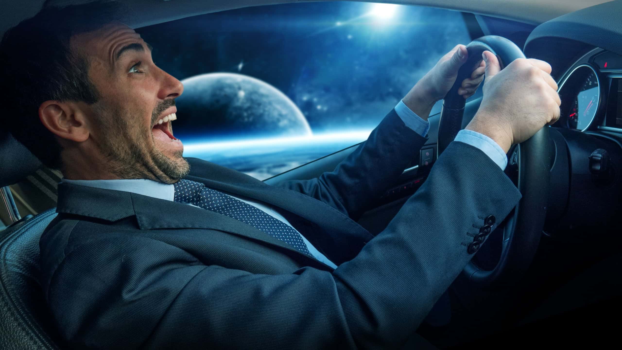 An young businessman is driving a futuristic car with autopilot to make a journey to the space. Concept of future, high technology and safe travels.