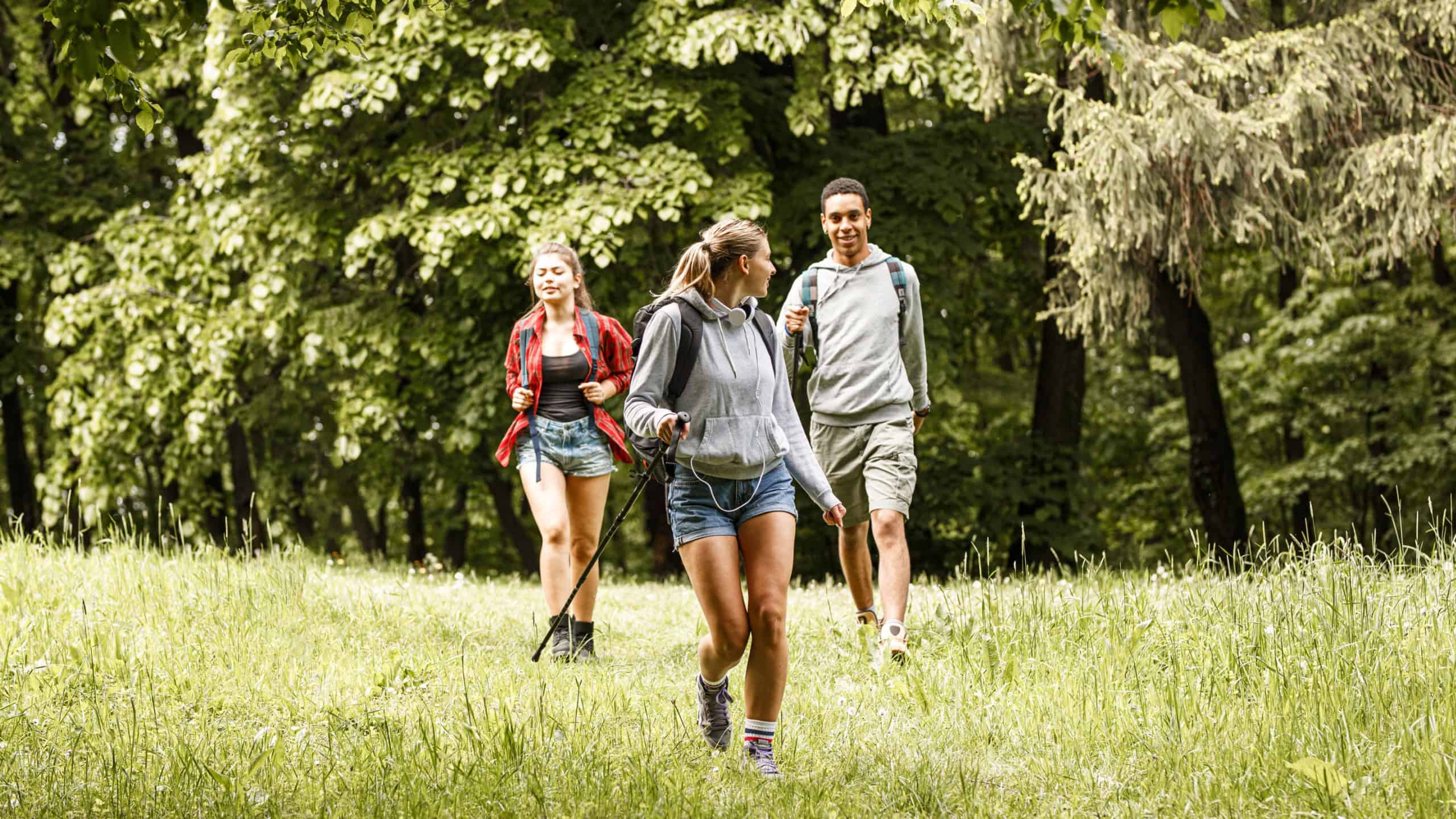 Woman walking ahead of friends